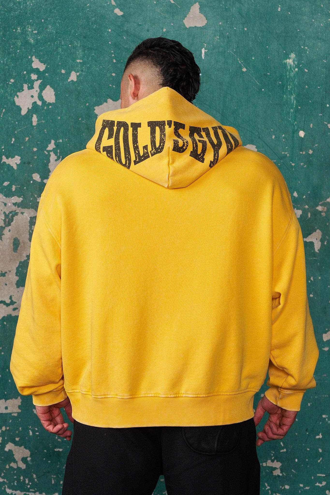 Front view of oversized hoodie showing distressed Golds Gym graphic
