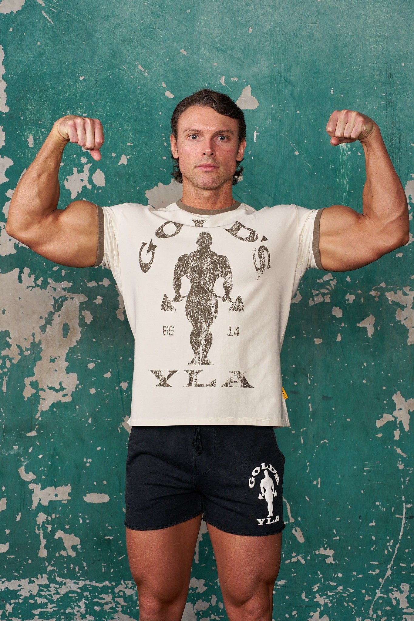 Front view of vintage Golds Gym ringer tee with distressed graphics