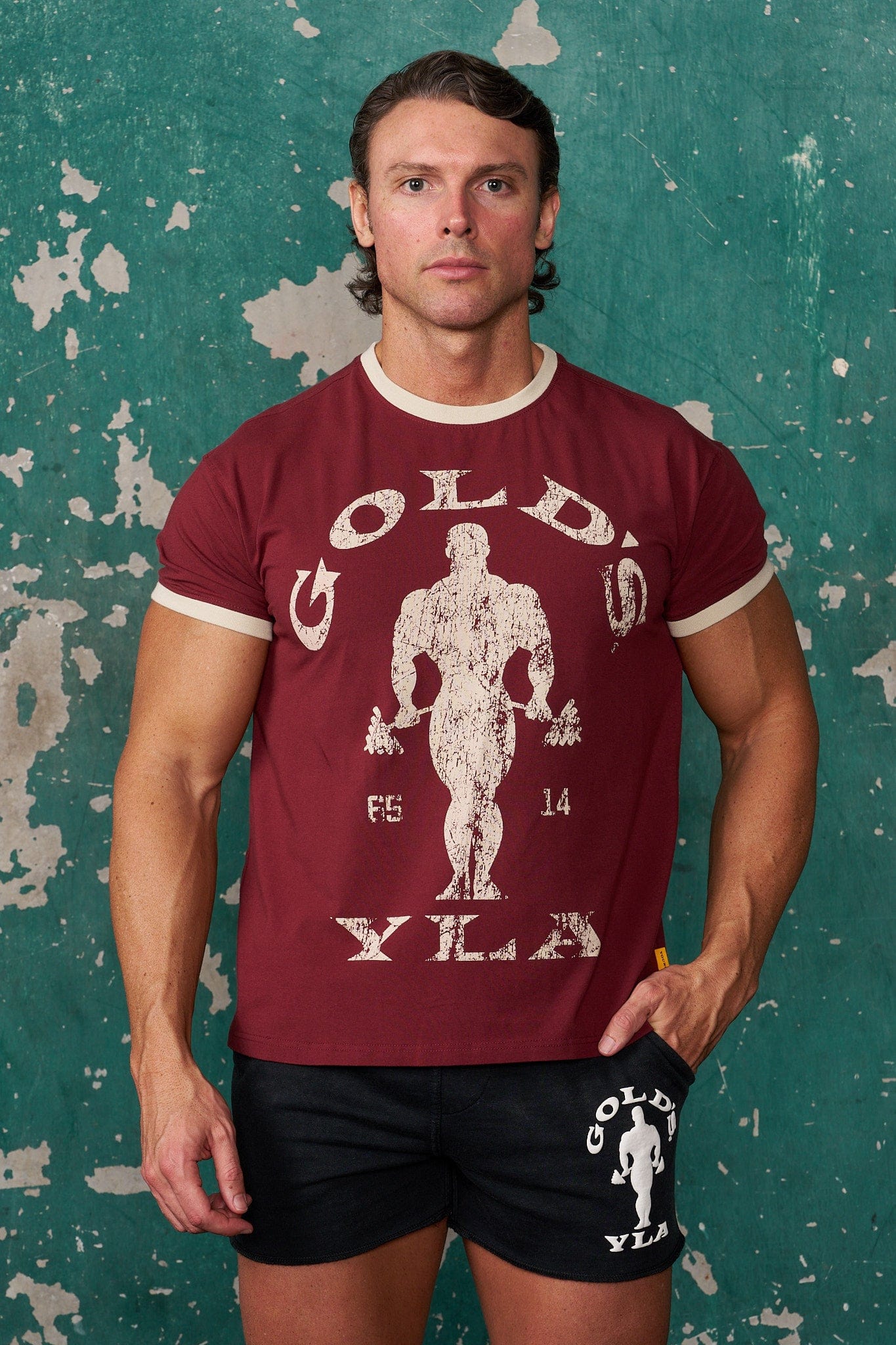 Front view of vintage Gold's Gym ringer tee with distressed graphics