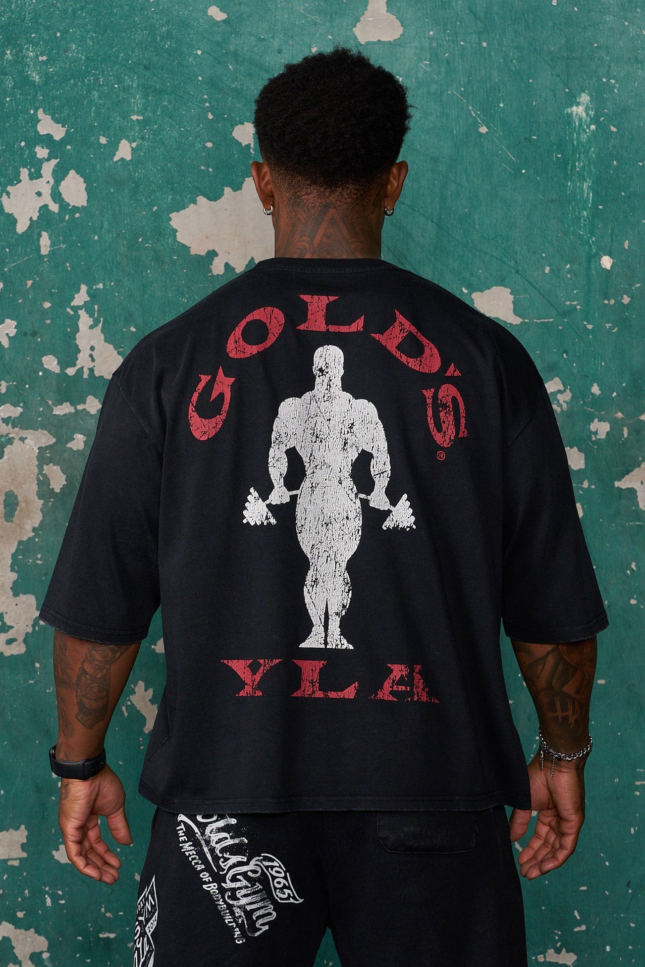 Front view of Golds Gym tee with boxy silhouette styled for streetwear