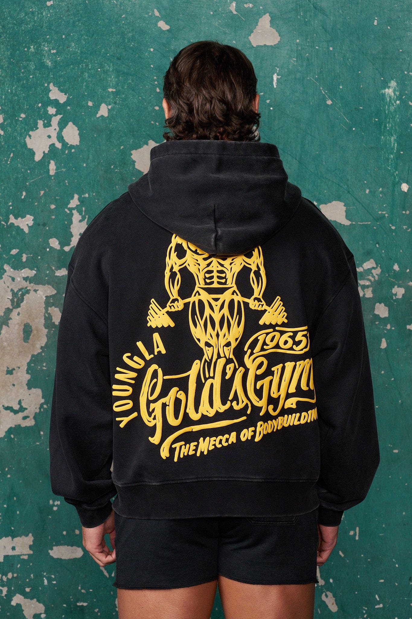 Gold's Gym oversized hoodie for men, worn unzipped with gym shorts