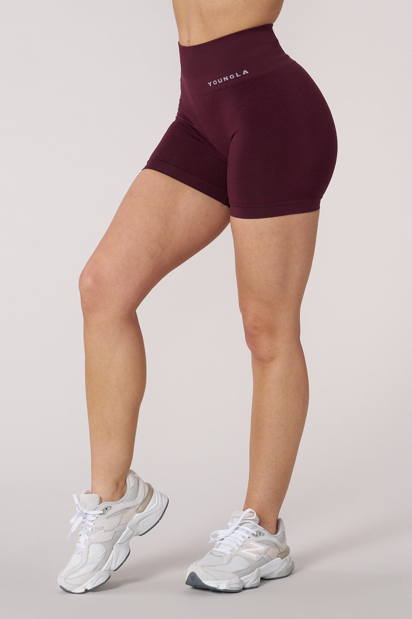 Close-up of the gentle waistband and back scrunch seam of the shorts.