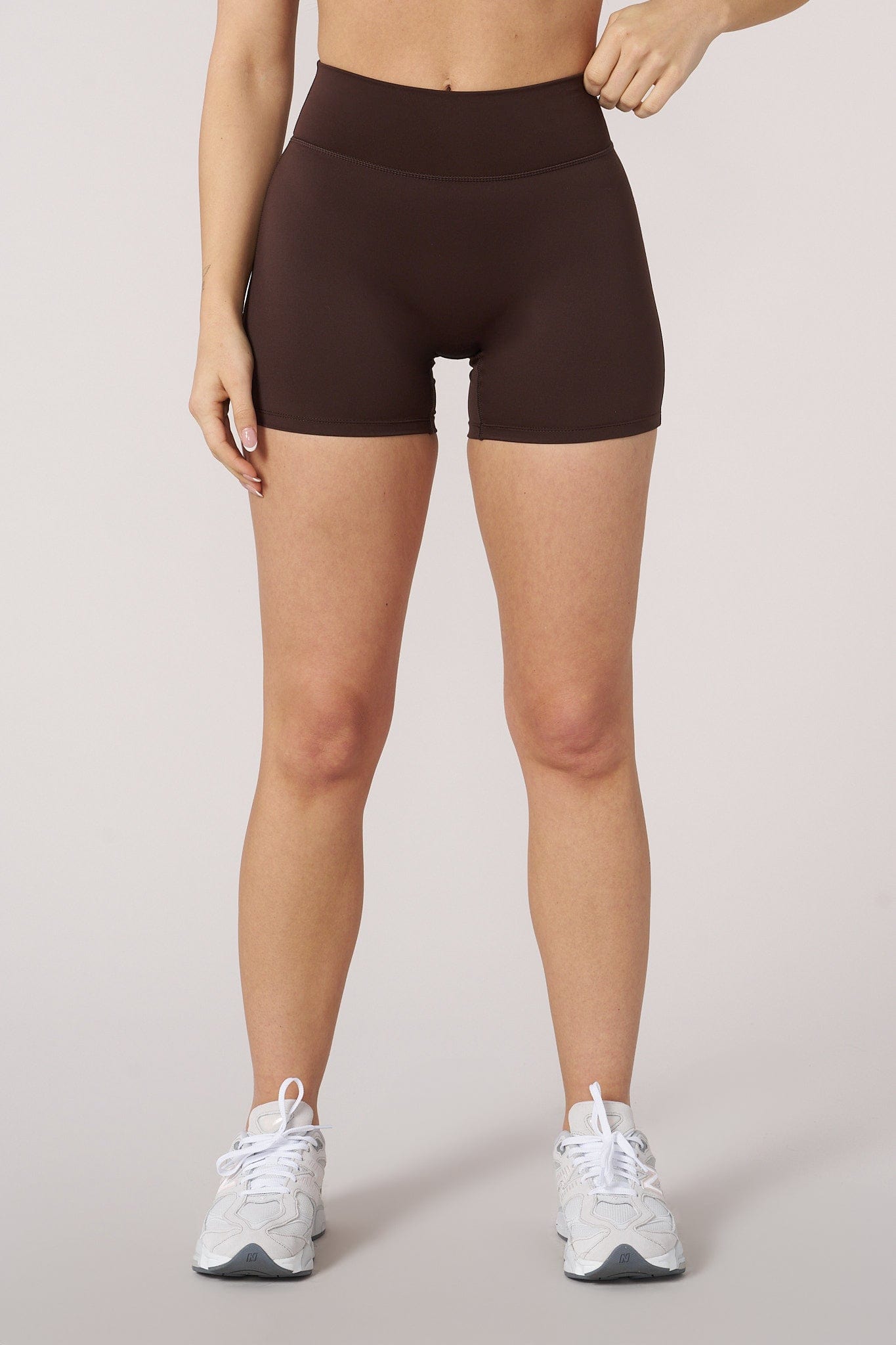 Model wearing Curve Biker Shorts paired with sports bra for activewear look