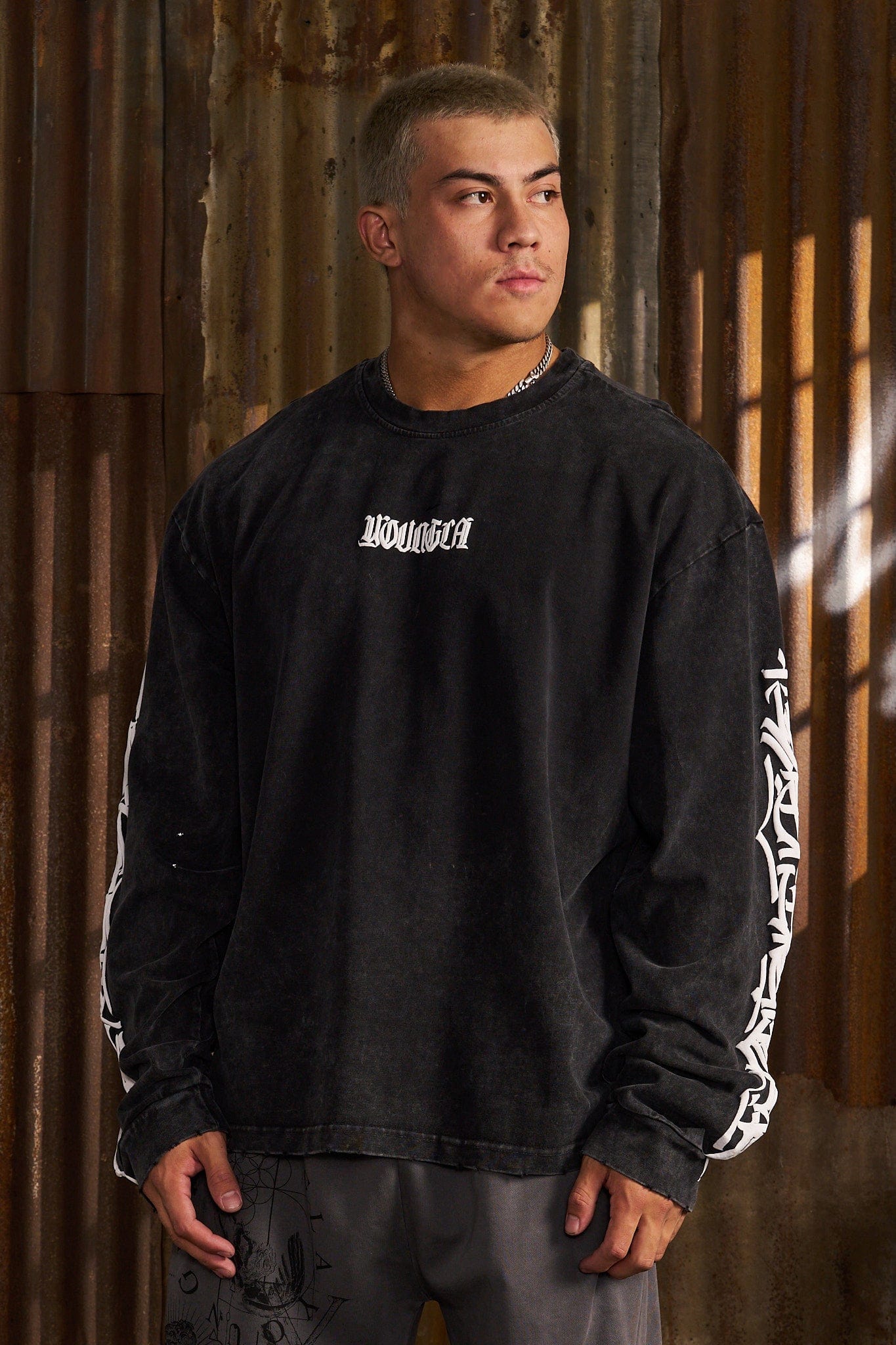 Front view of Aura Vintage Long Sleeve T-Shirt showcasing distressed cuffs.