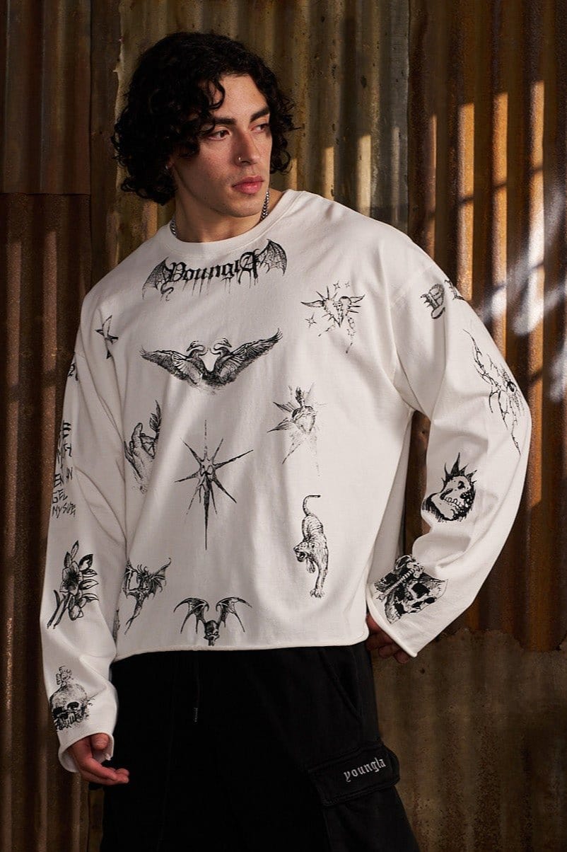 Close-up of sketchy long sleeve graphic shirts on cotton fabric