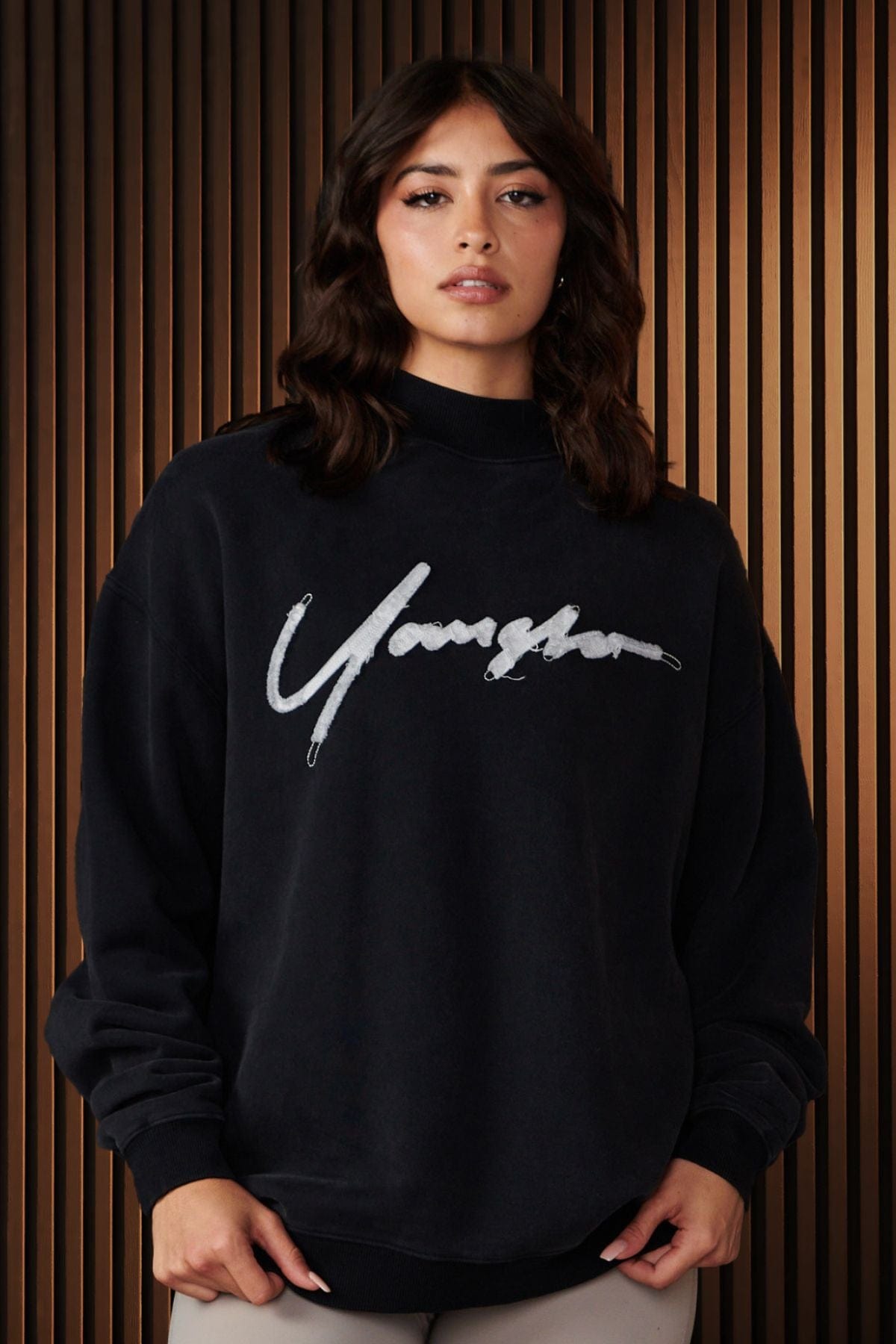 Model wearing the Urban Crewneck in a winter street style setting, showcasing its relaxed fit