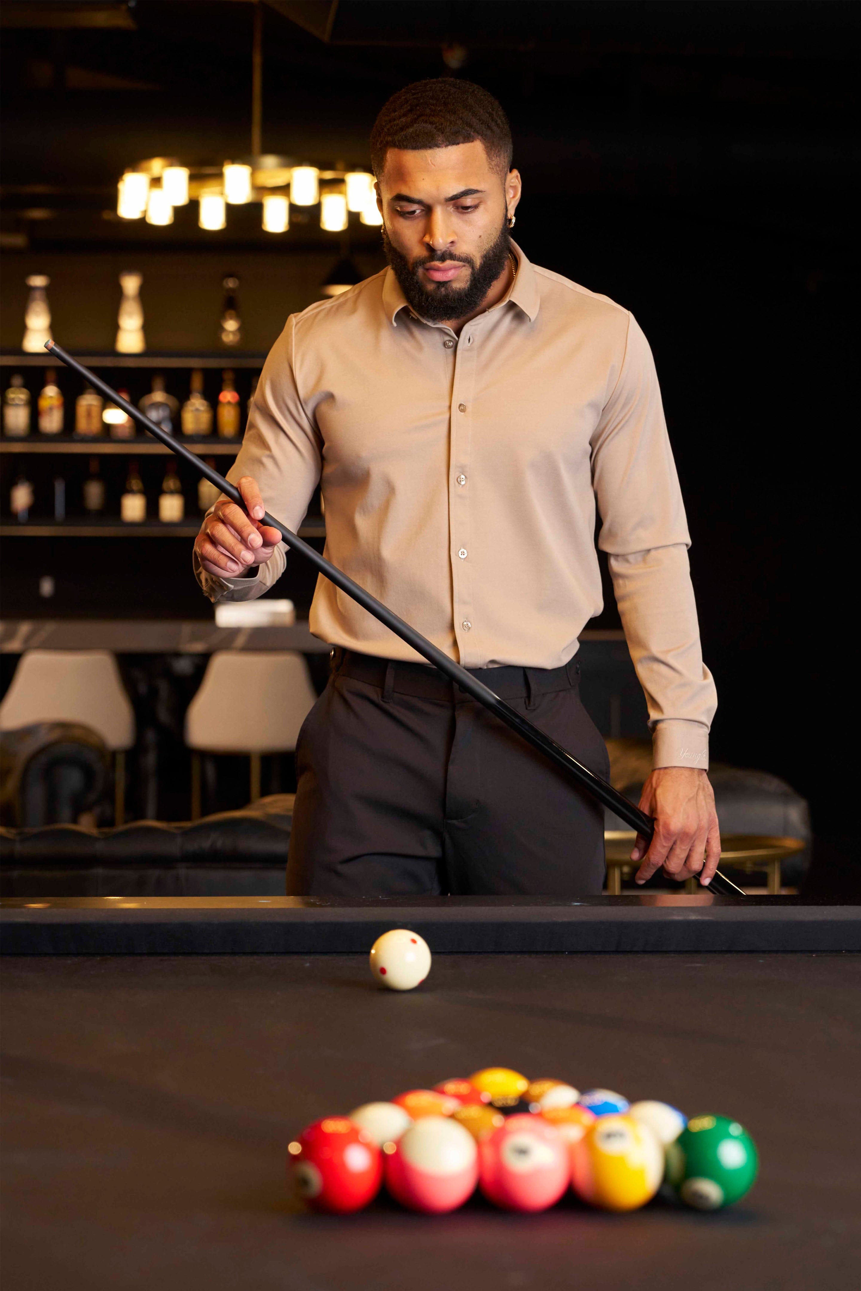 Detail of the shirts collar and buttons, highlighting its tailored design.