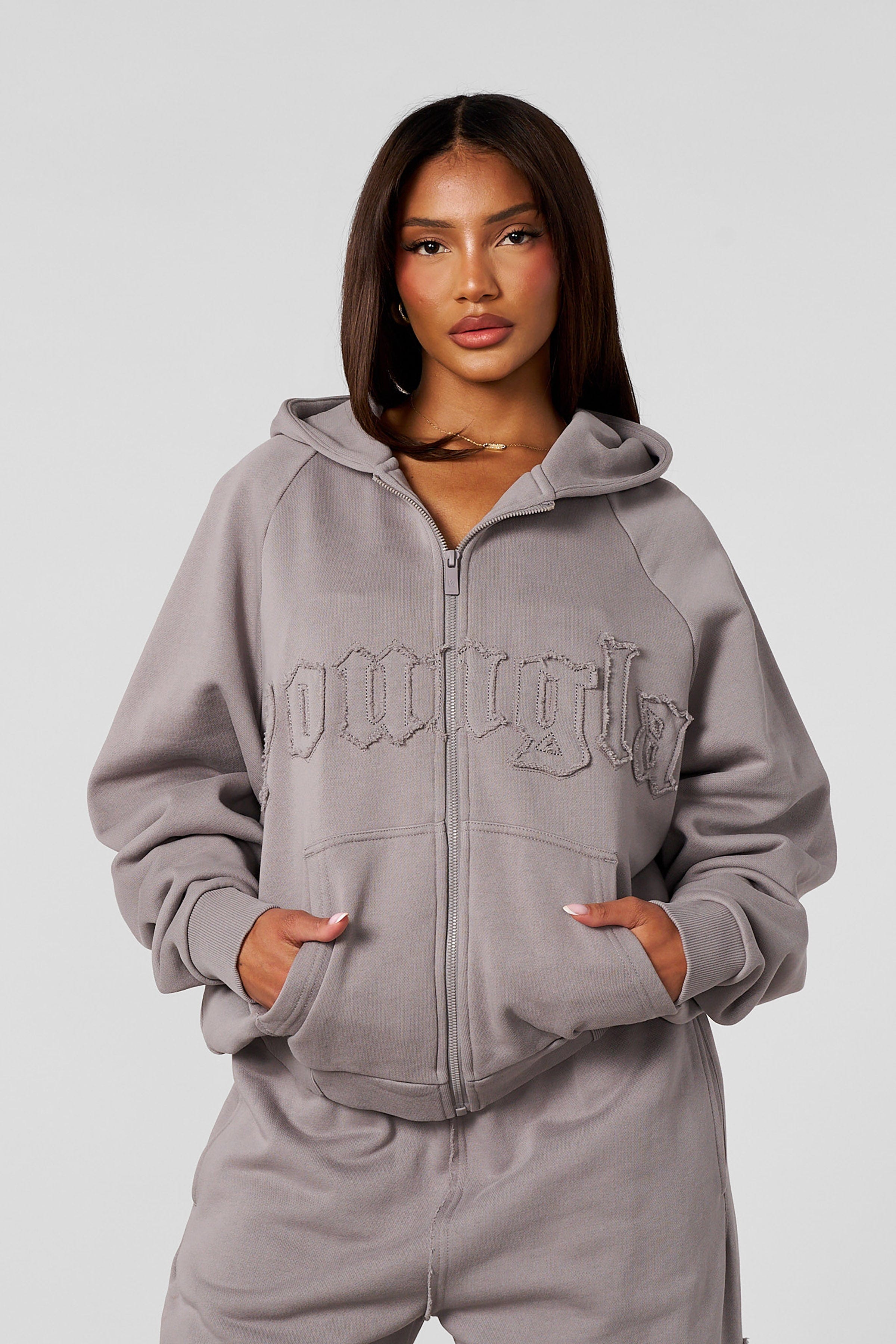 Front view of the cozy oversized zip-up hoodie, showcasing its stylish design.