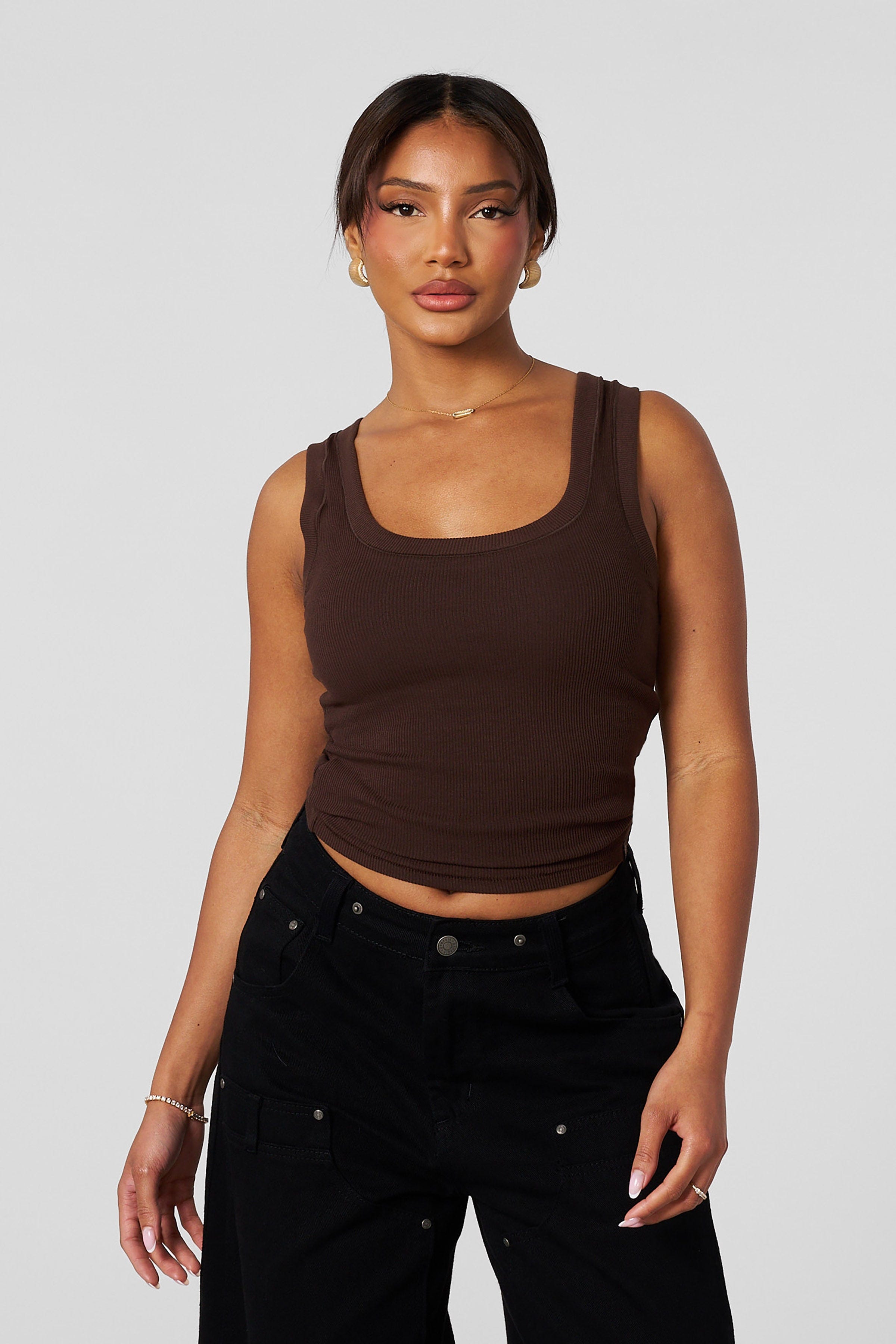 Model wearing womens ribbed tank top styled for casual wear