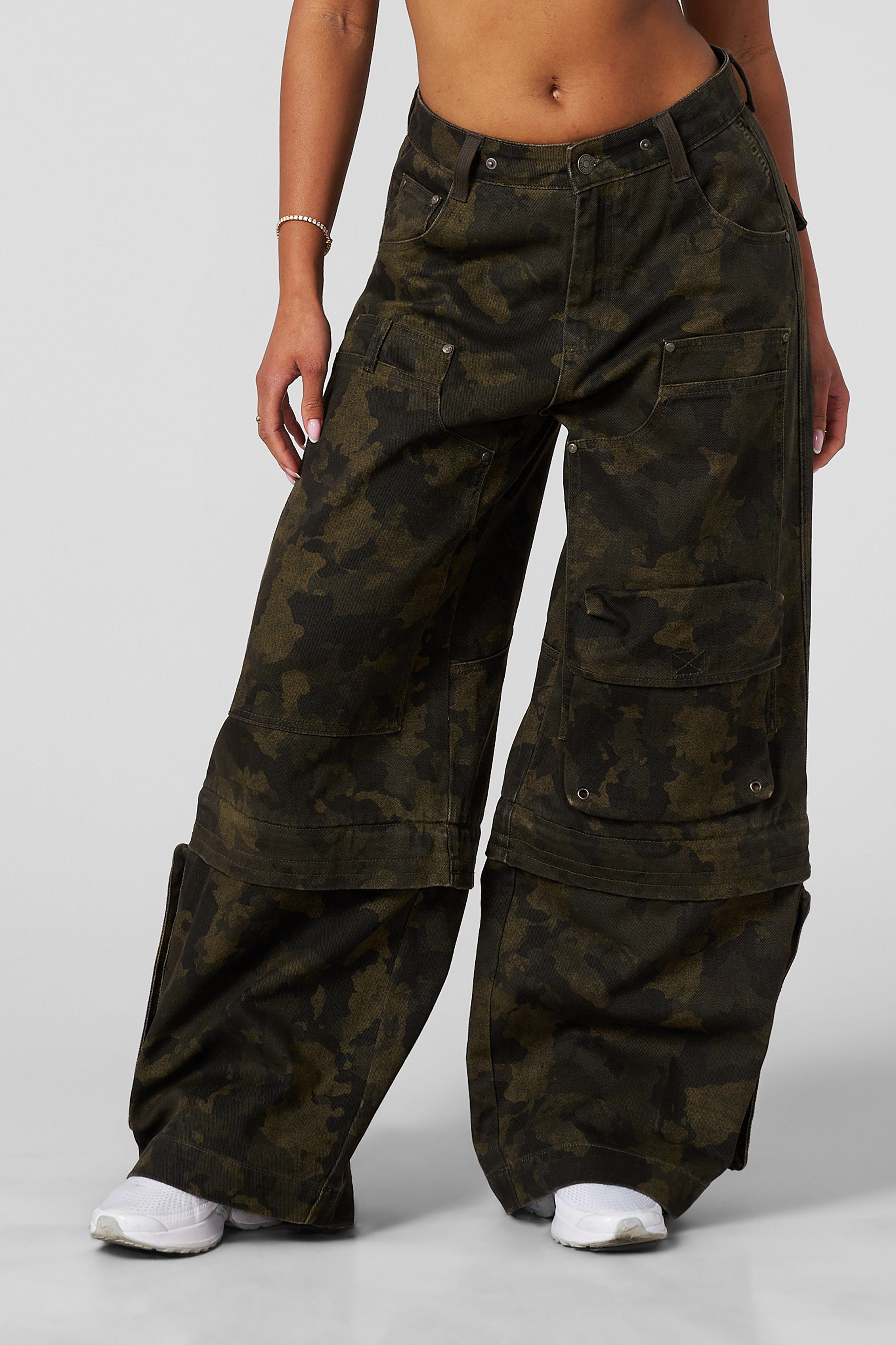 Black oversized jeans laid flat with visible pocket design for practical styling