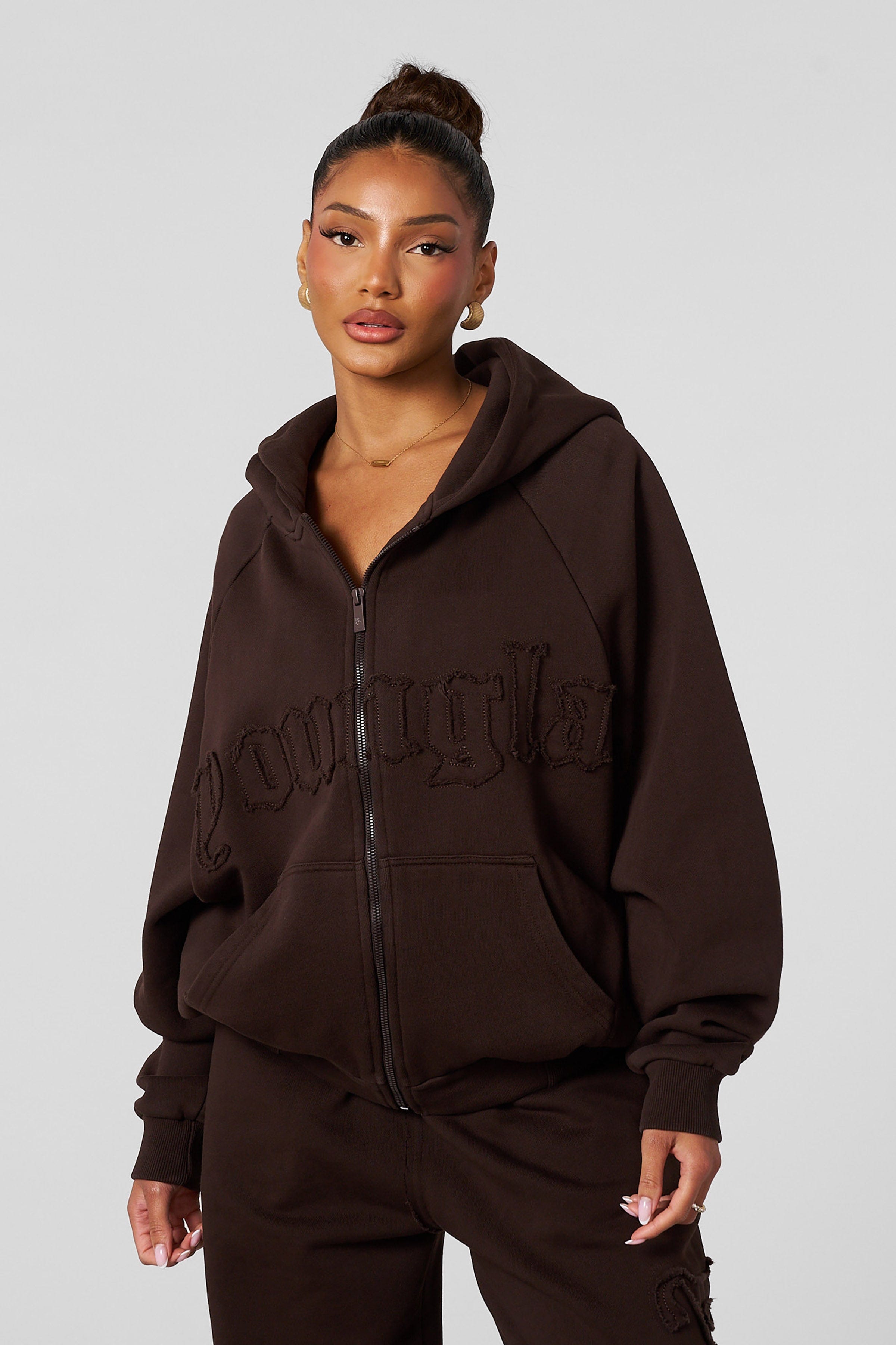 Front view of the cozy oversized zip-up hoodie, showcasing its stylish design.