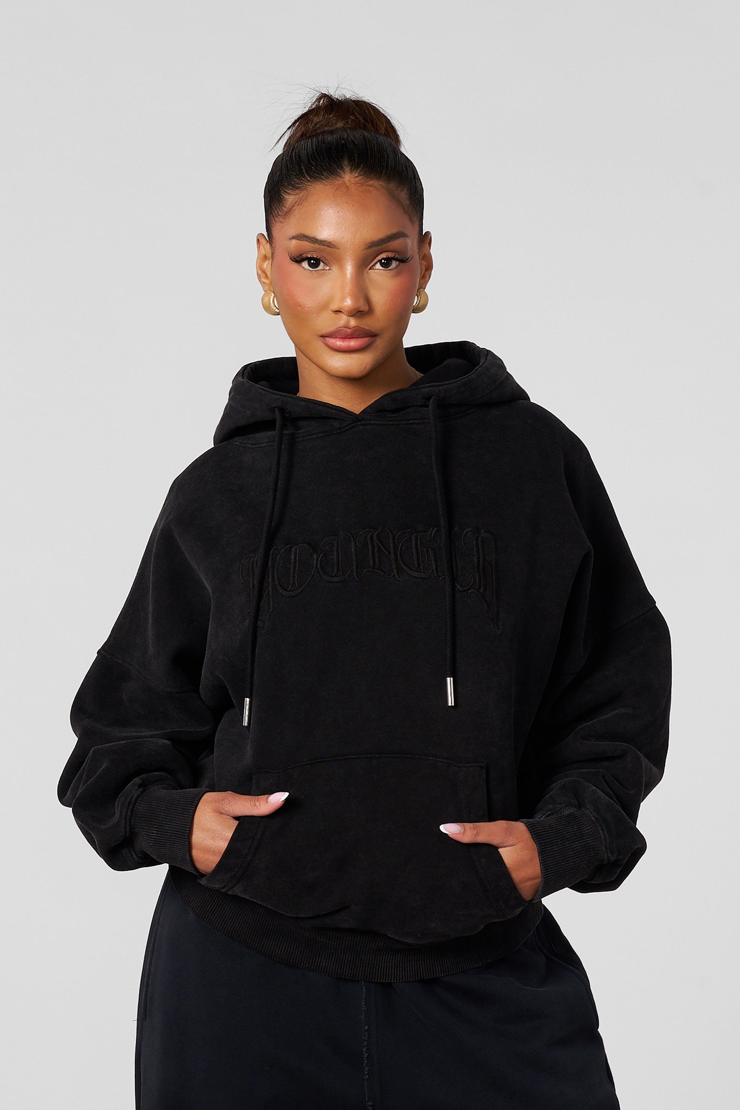 Close-up of the embroidery on the oversized hoodie for men and women
