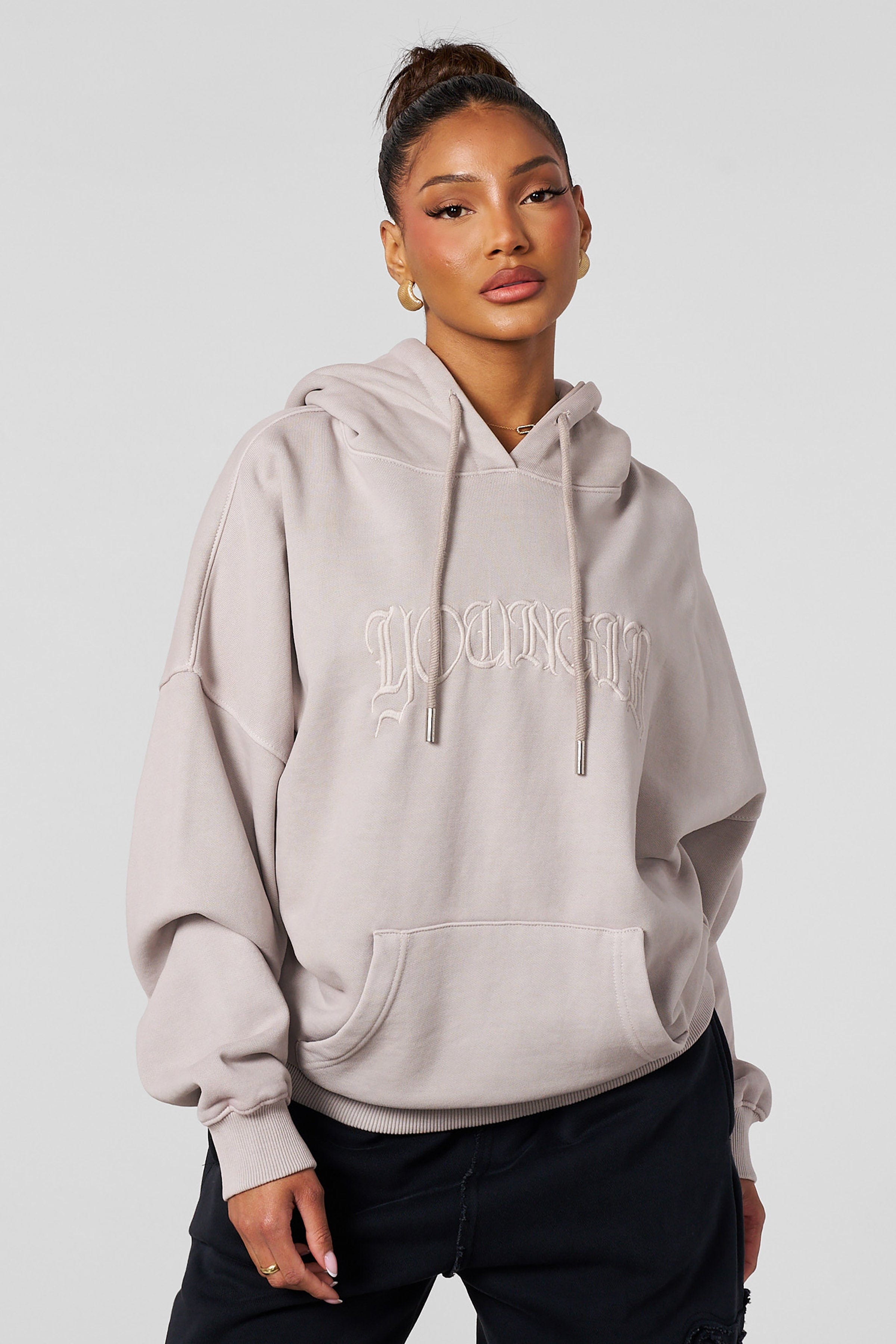 Close-up of the embroidery on the oversized hoodie for men and women