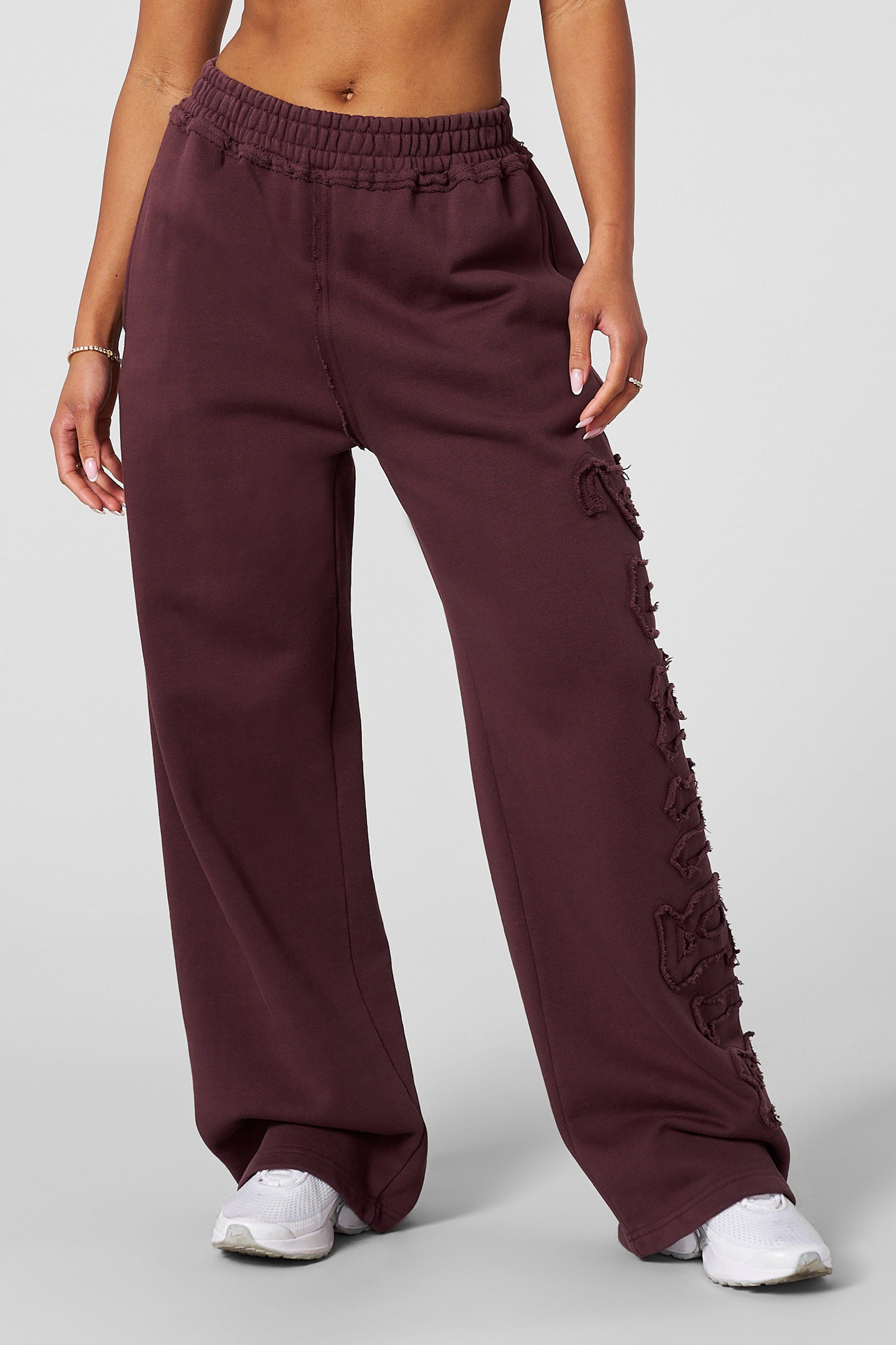 Model lounging in organic cotton joggers, ideal for everyday wear.