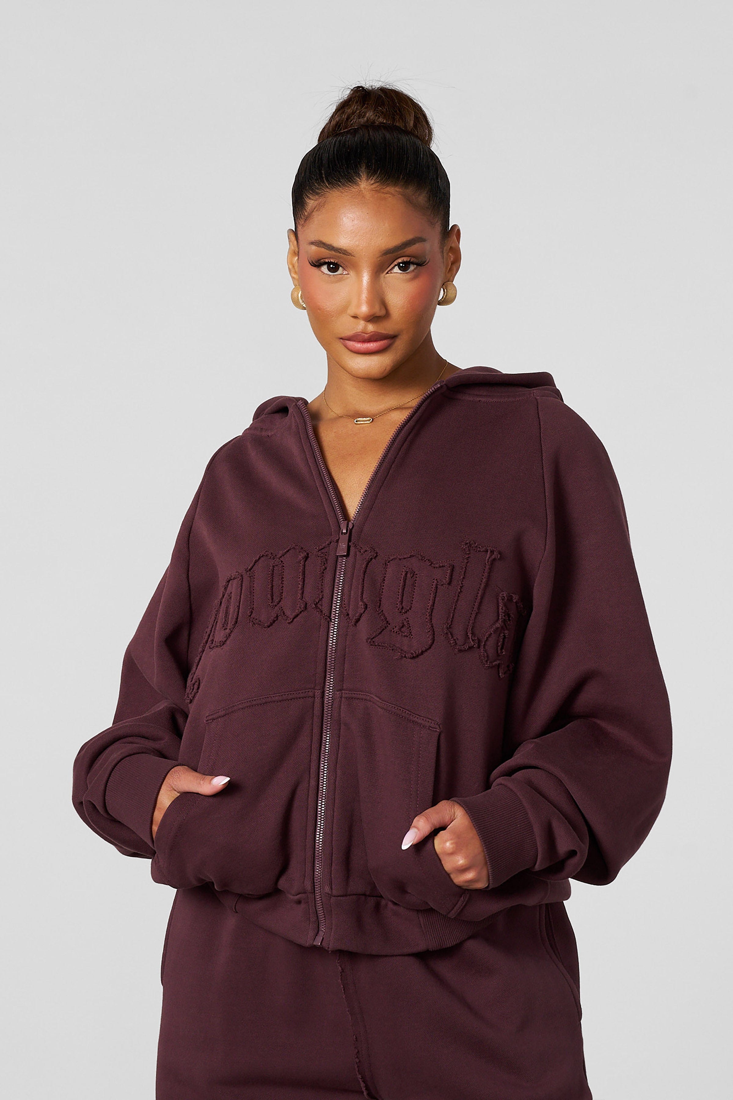 Front view of the cozy oversized zip-up hoodie, showcasing its stylish design.