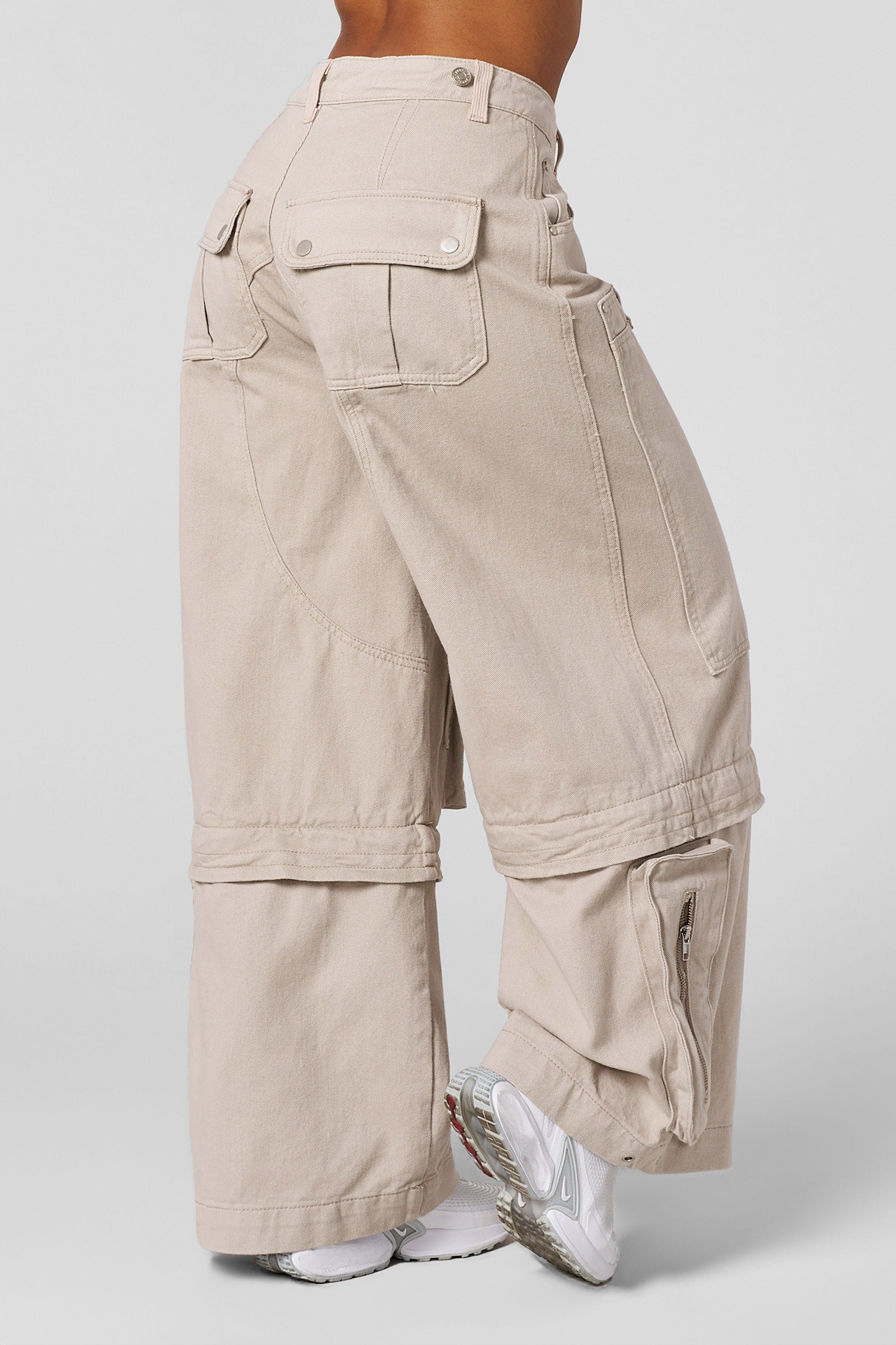 Black oversized jeans laid flat with visible pocket design for practical styling