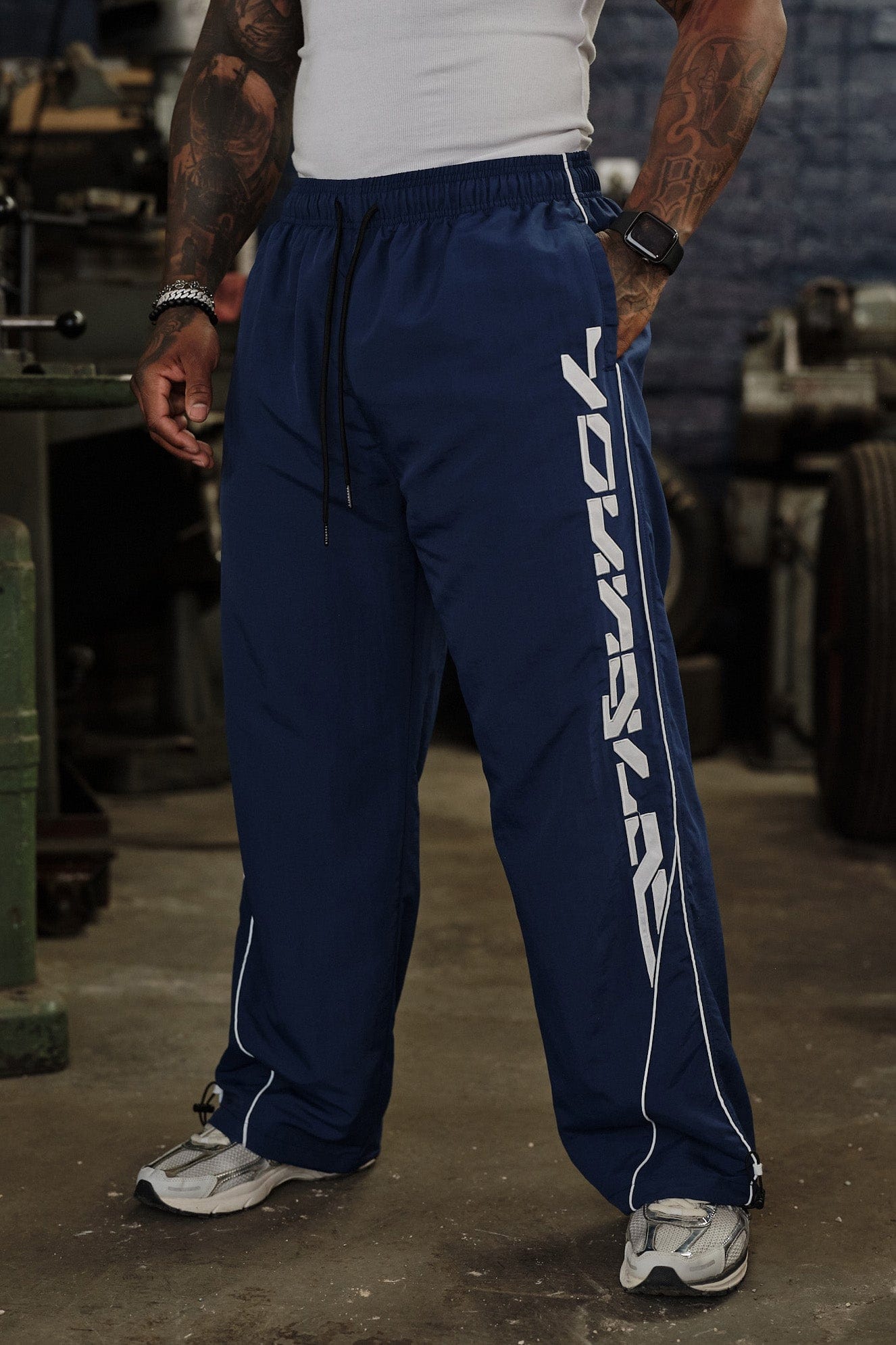 Model wearing Foundation Performance Track Pants during a workout session.