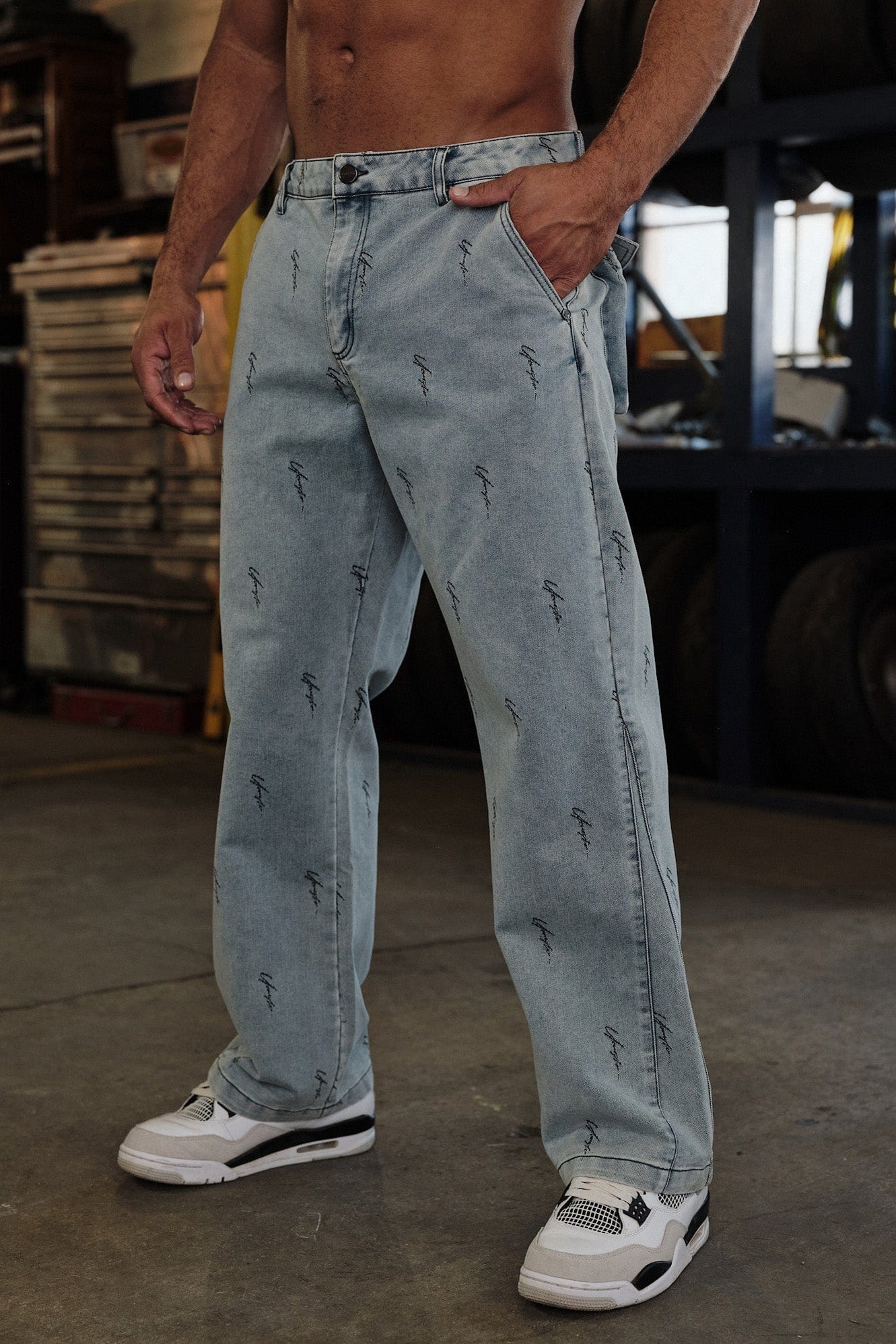 True Religion baggy jeans front view, showcasing logo detailing and relaxed fit.