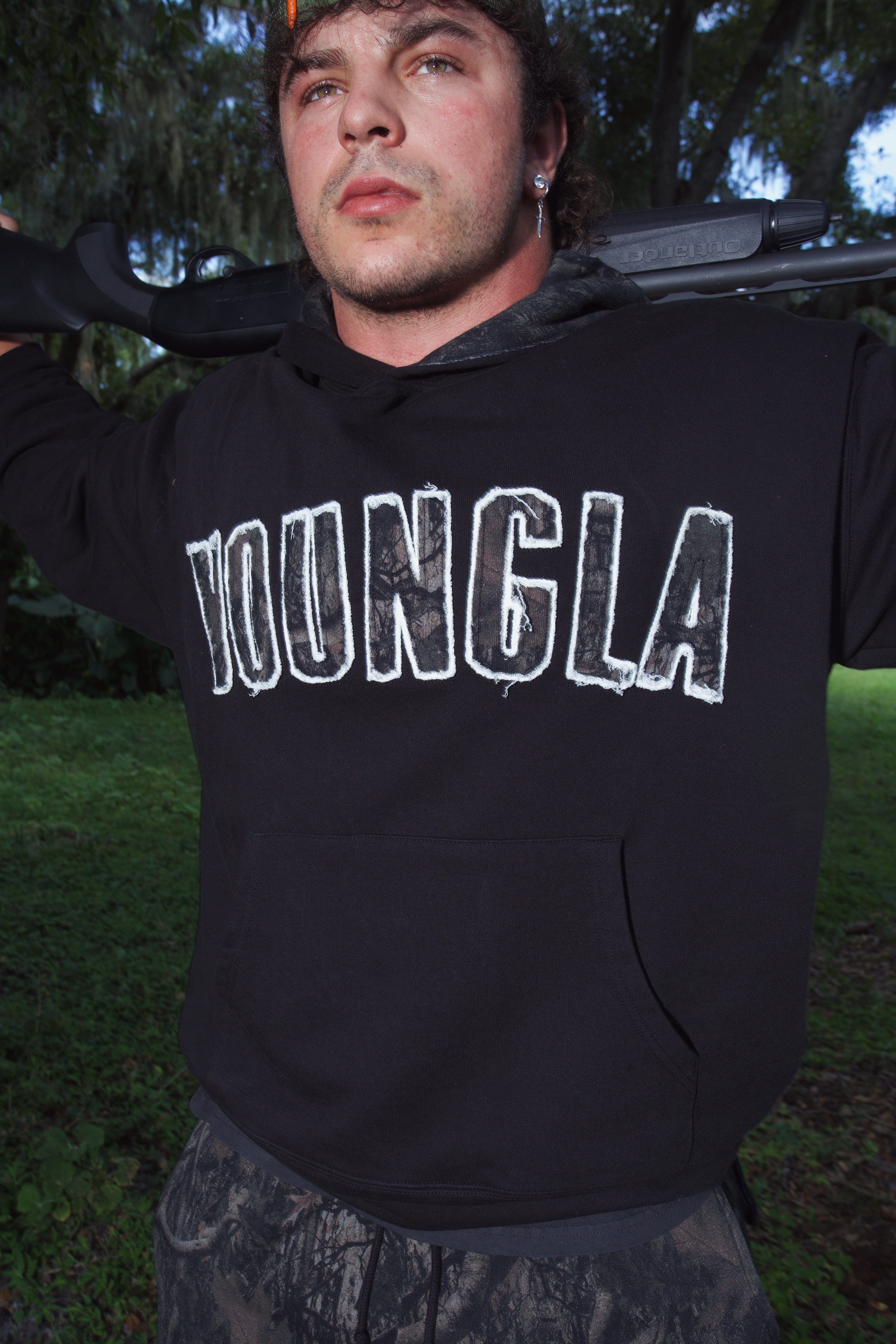 Model showcasing the oversized hoodie during an outdoor adventure.