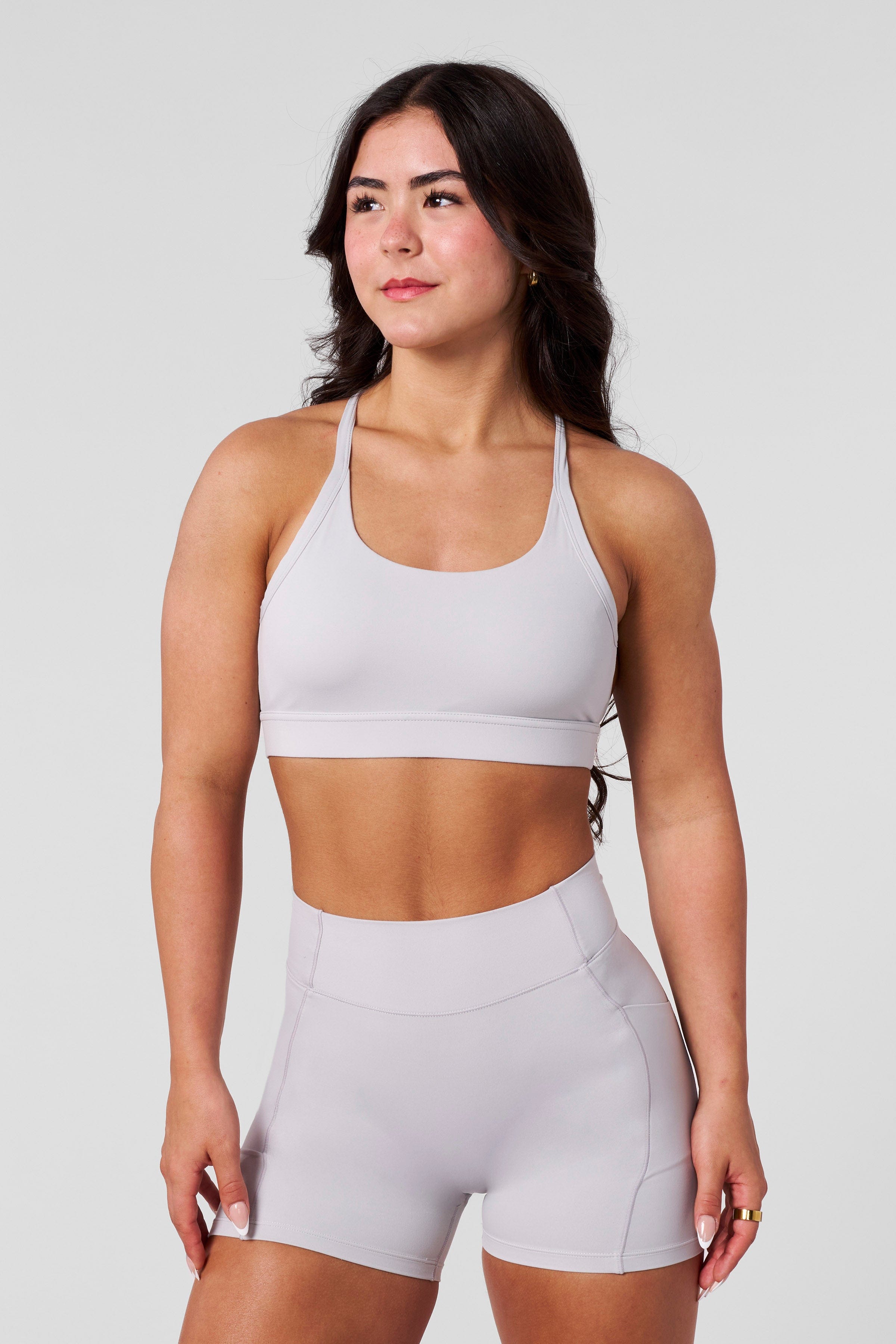 Model wearing Nova compression sports bra during an intense workout.