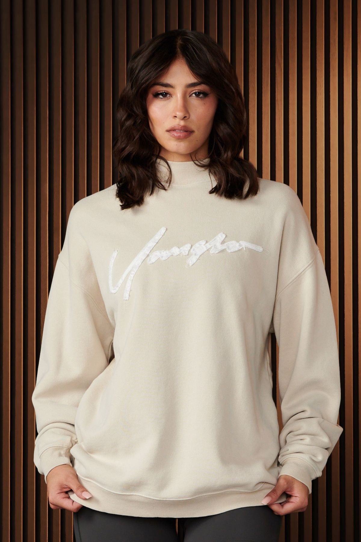 Front view of the Urban Crewneck sweatshirt highlighting the bold logo and cozy terry material