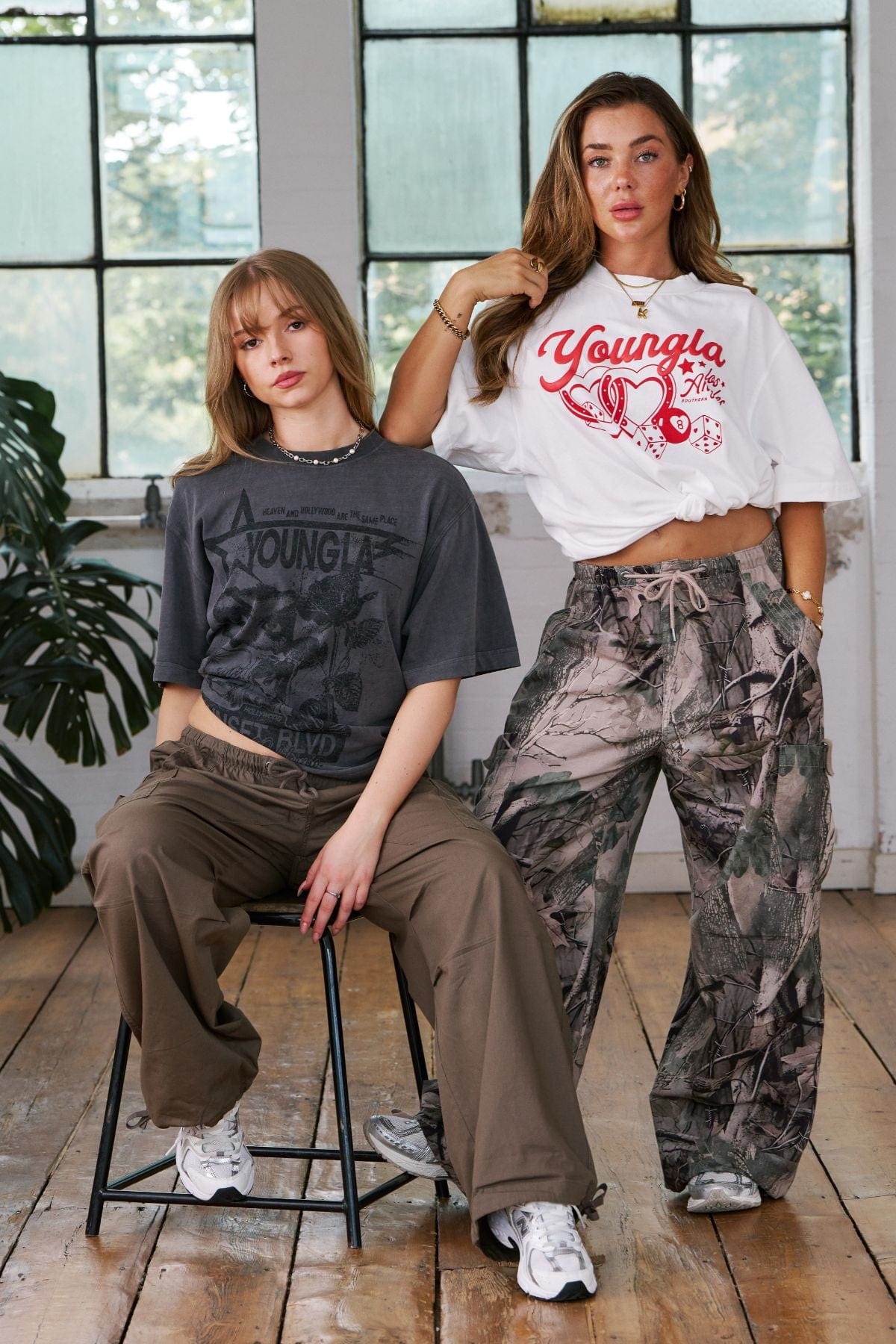 Close-up of oversized graphic tee showing bold artwork and textured cotton
