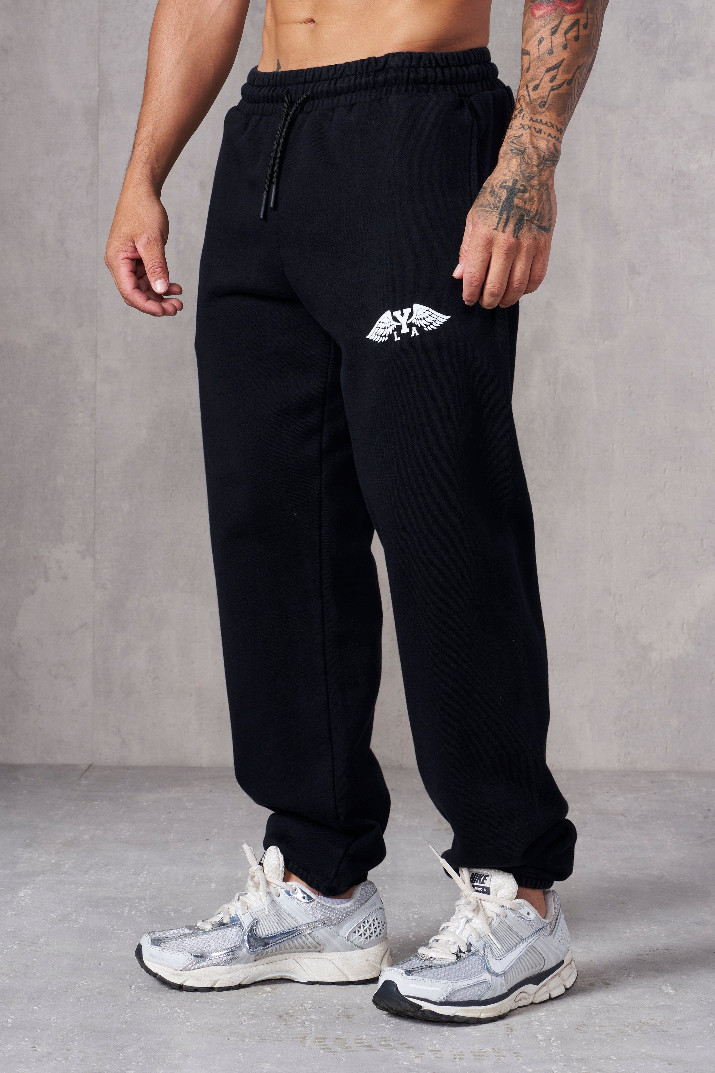 Close-up of cotton joggers showing textured fabric and cuffed hem.