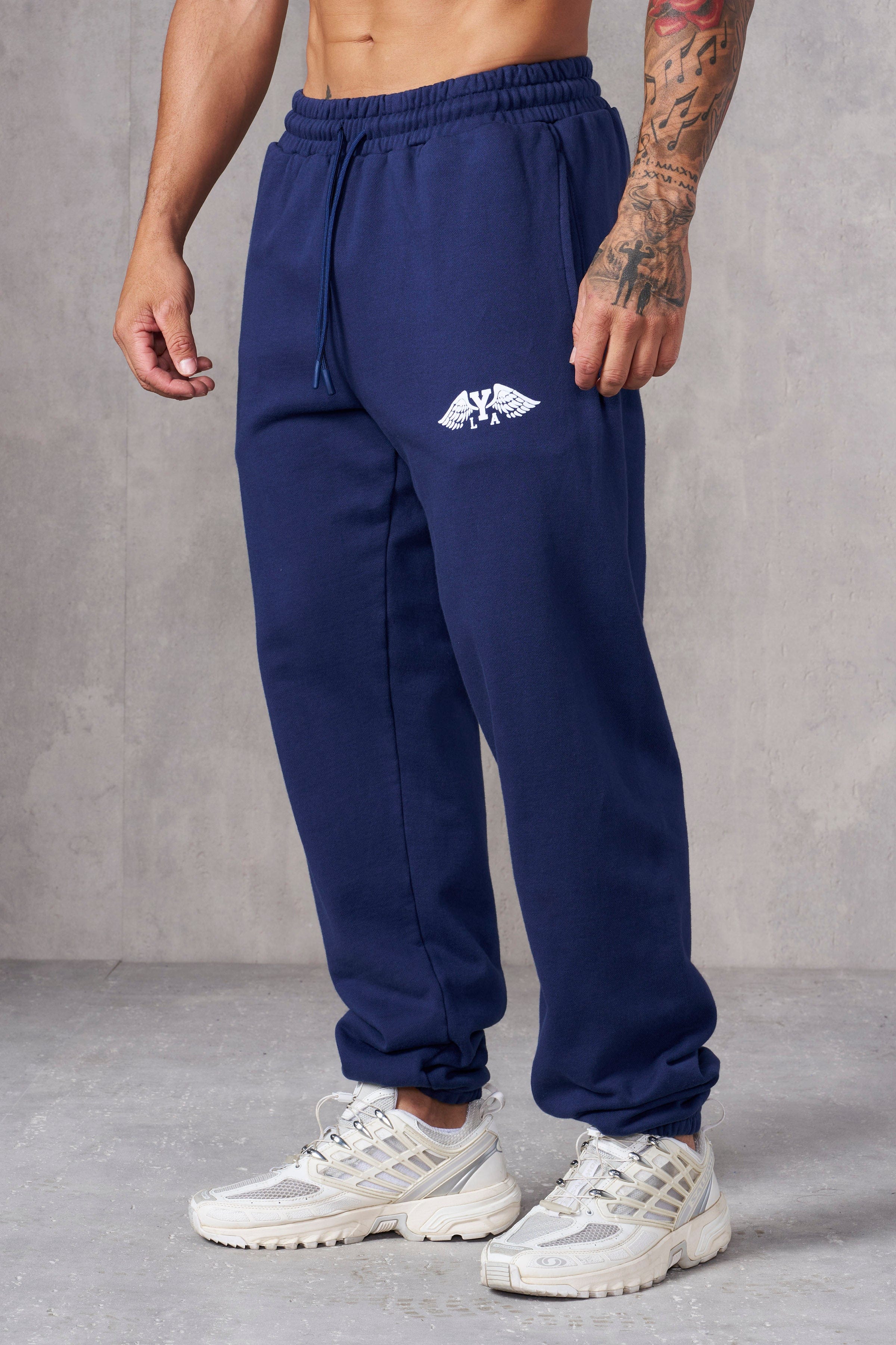 Close-up of cotton joggers showing textured fabric and cuffed hem.