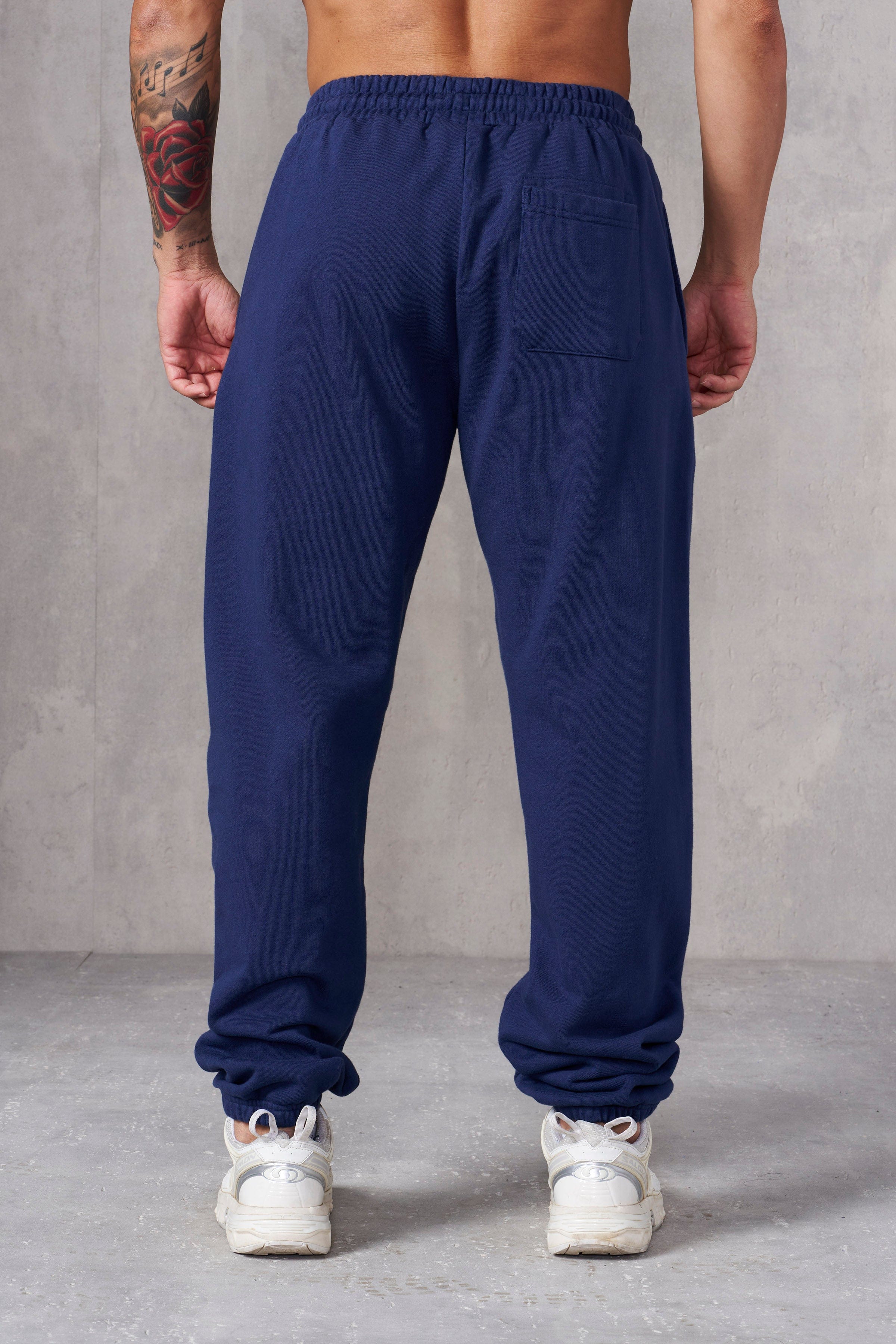 Close-up of cotton joggers showing textured fabric and cuffed hem.
