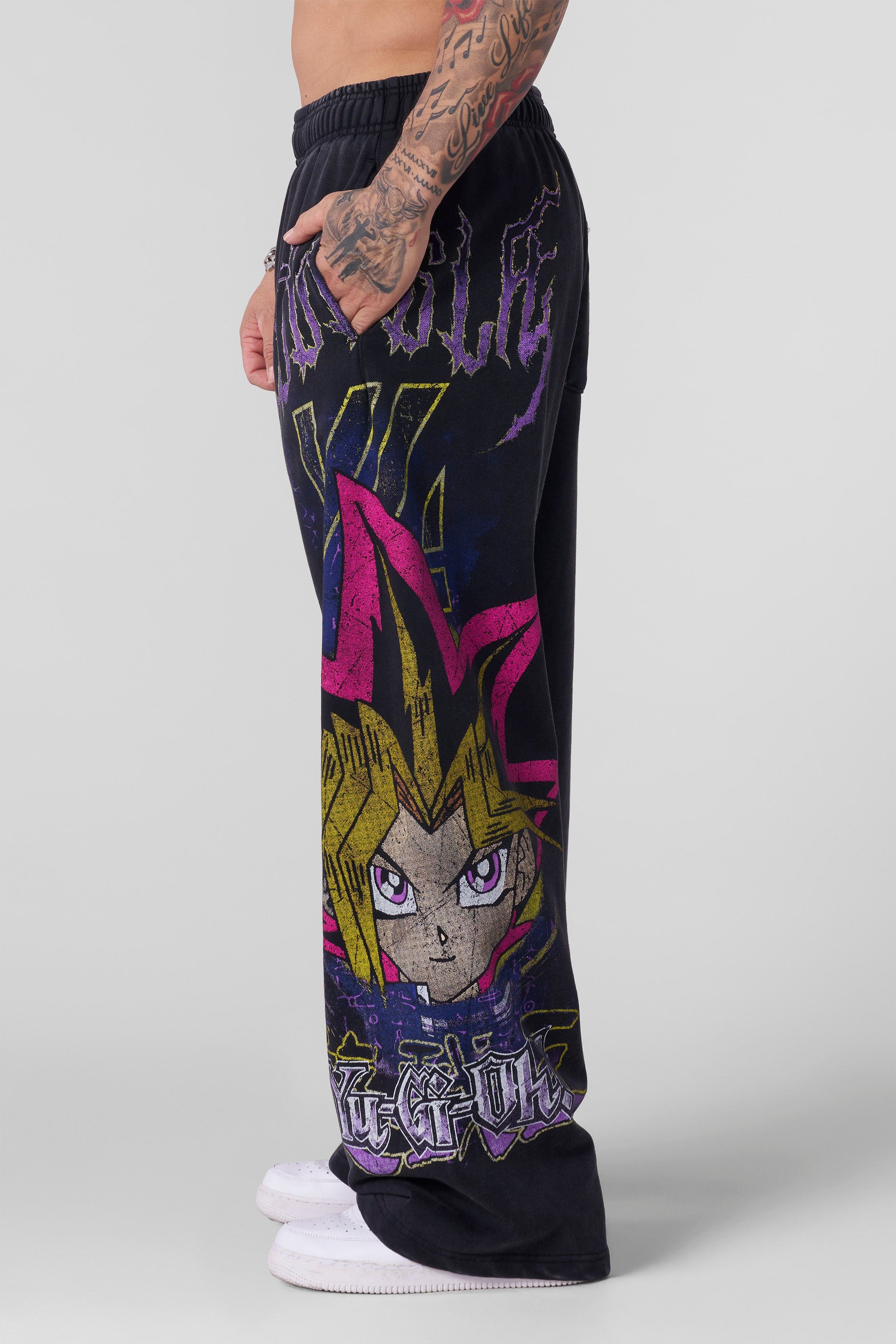 Front view of baggy gray sweatpants with Yu-Gi-Oh! graphic print