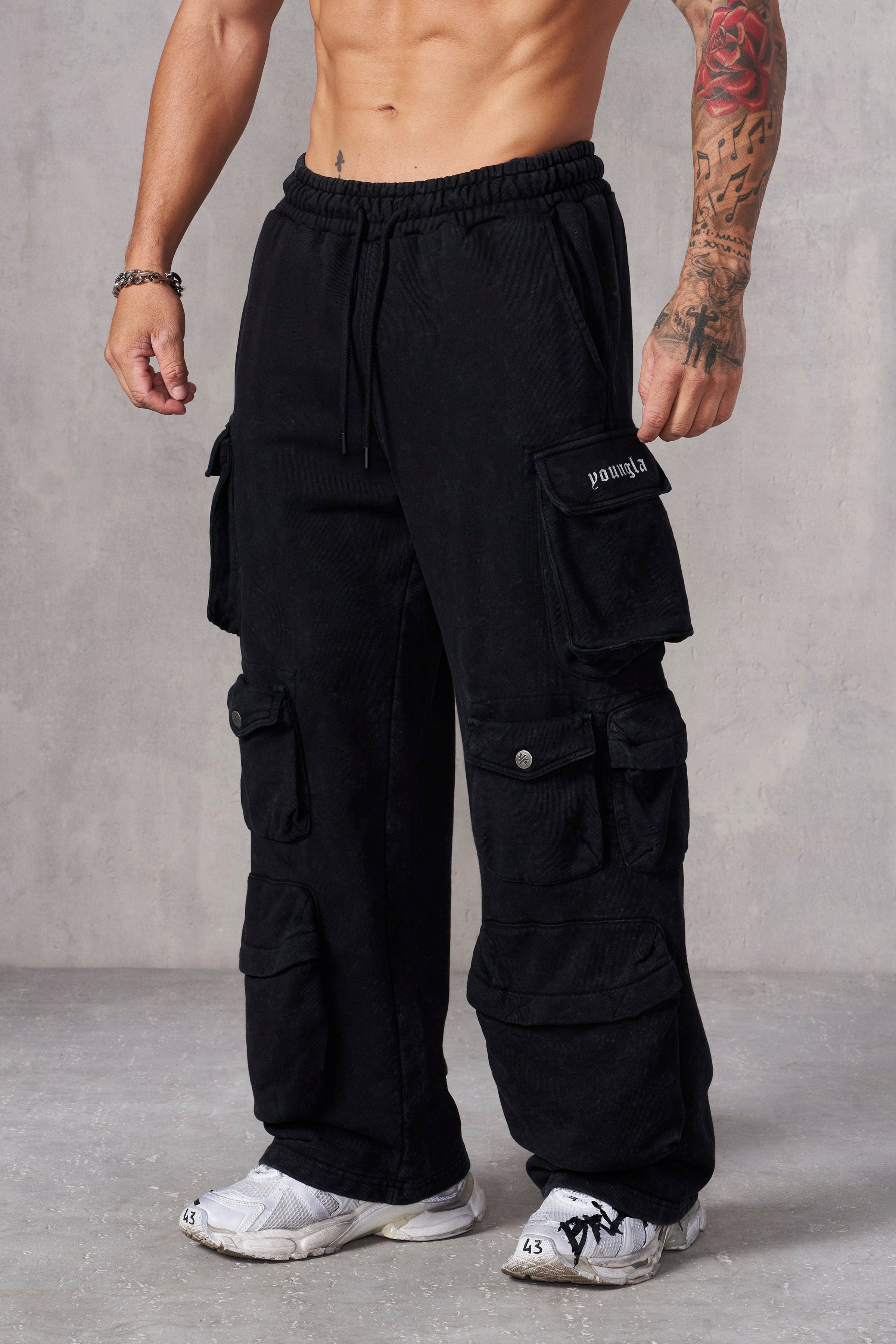 Model showcasing streetwear look with comfortable clothing in urban setting