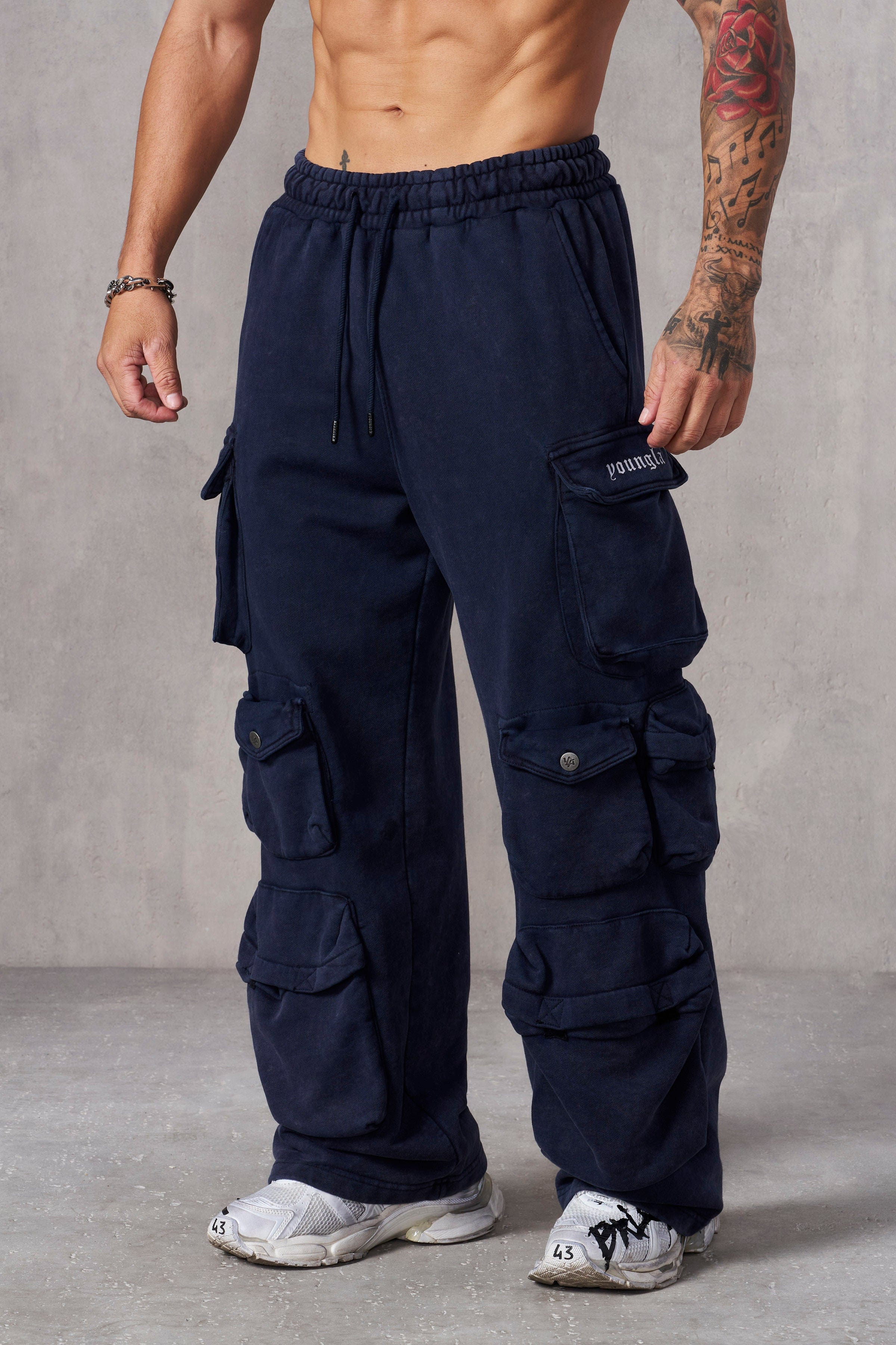 Model showcasing streetwear look with comfortable clothing in urban setting