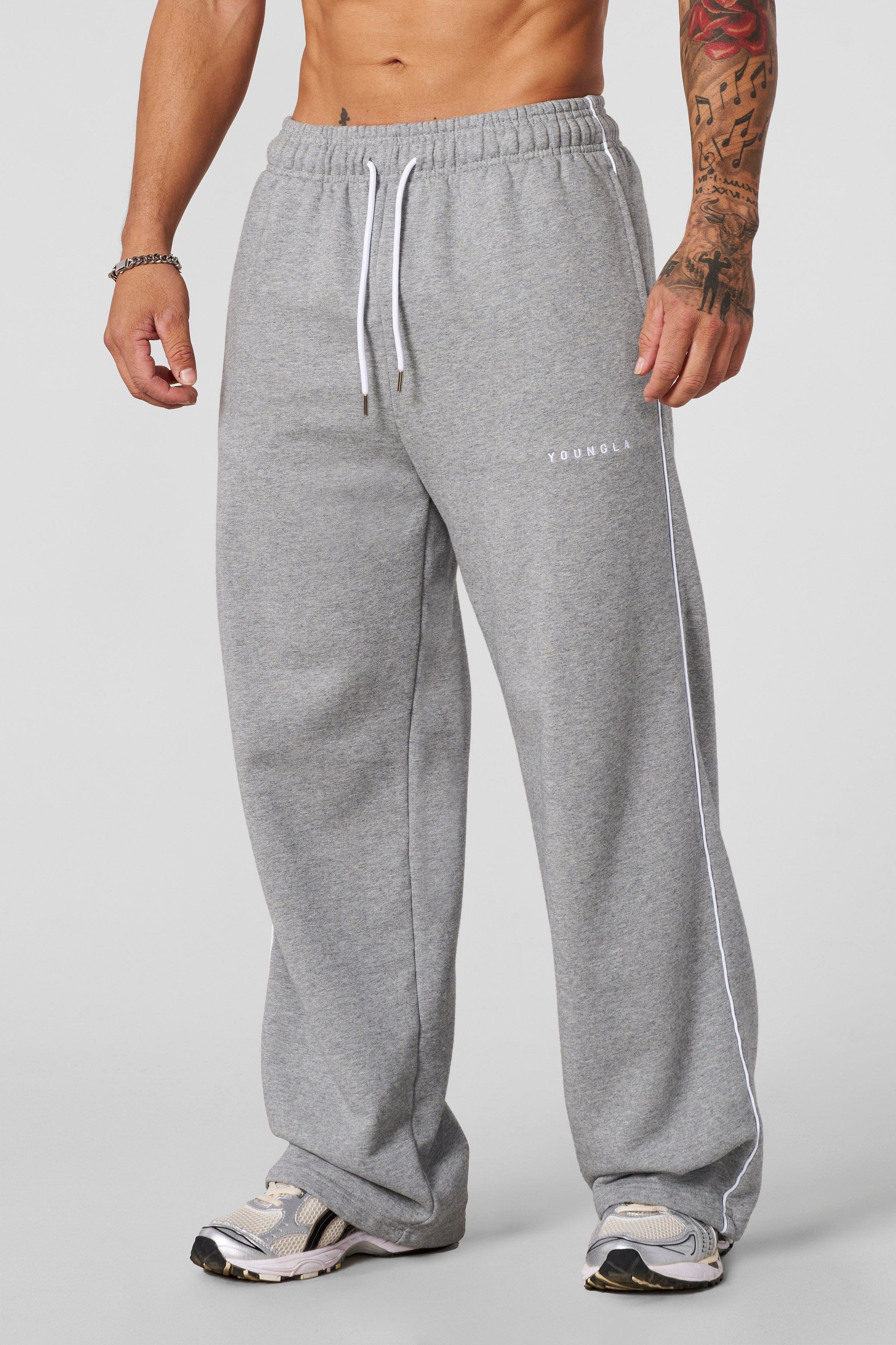 Front view of heavyweight cotton joggers with baggy fit and side piping