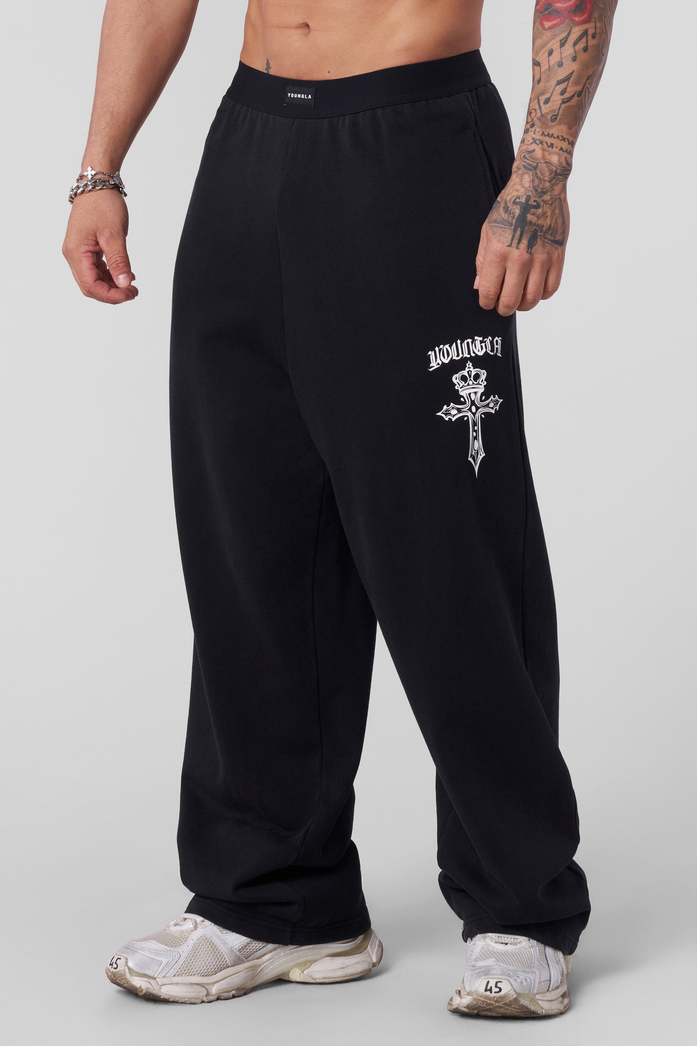 Front view of Faith Sweats showing relaxed baggy fit and cross logo