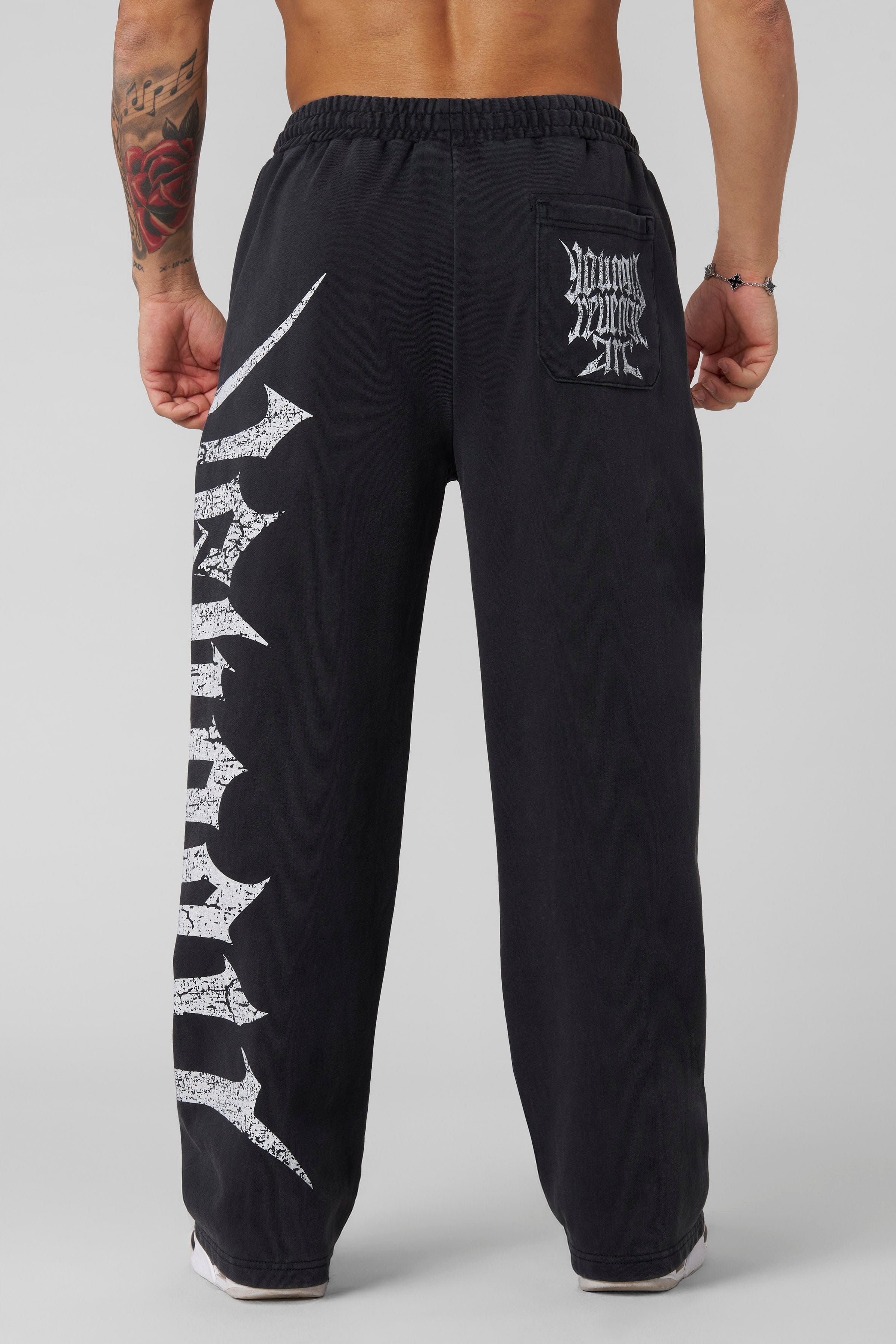 Side view showing loose fit and tapered leg for casual streetwear