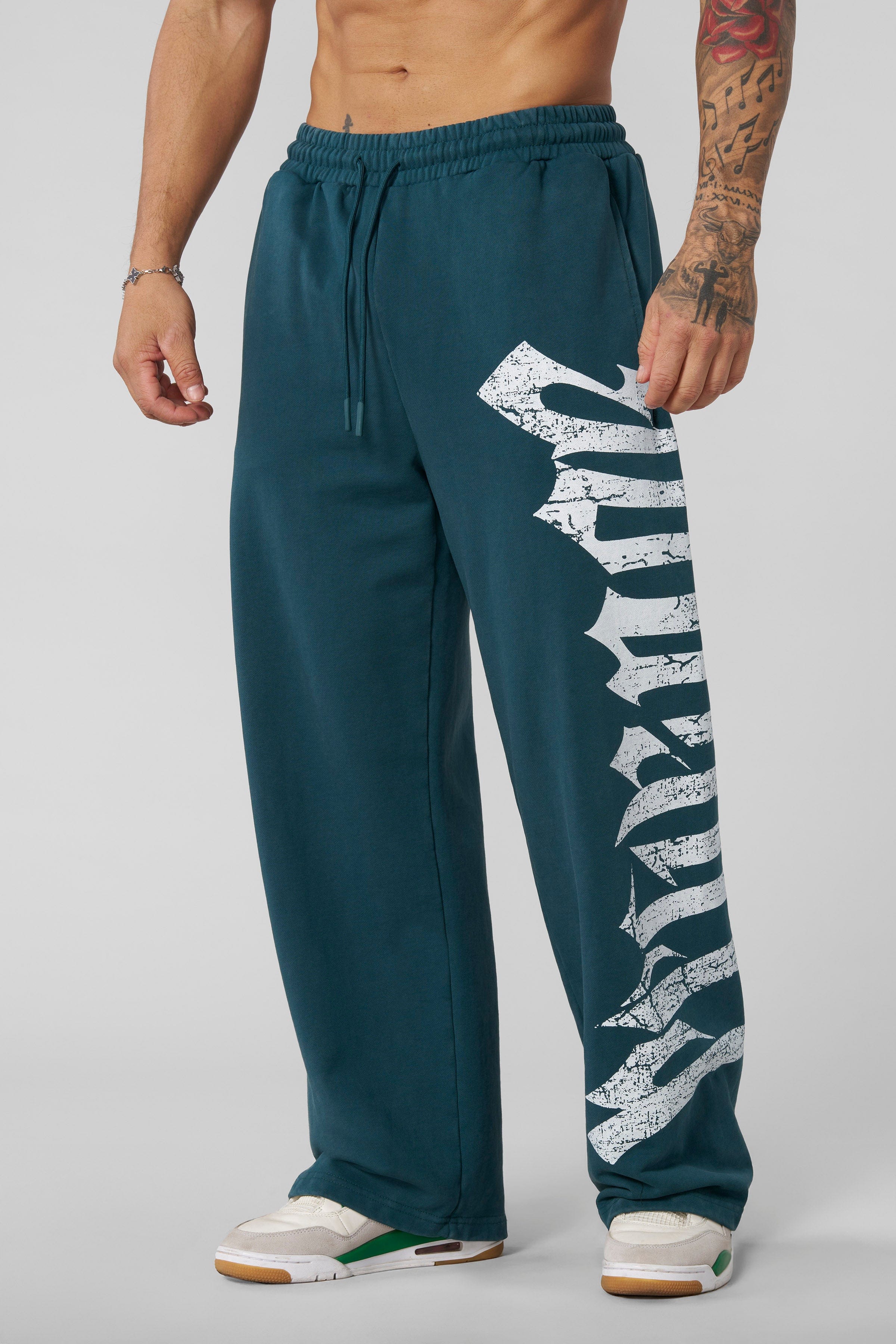 Side view showing loose fit and tapered leg for casual streetwear