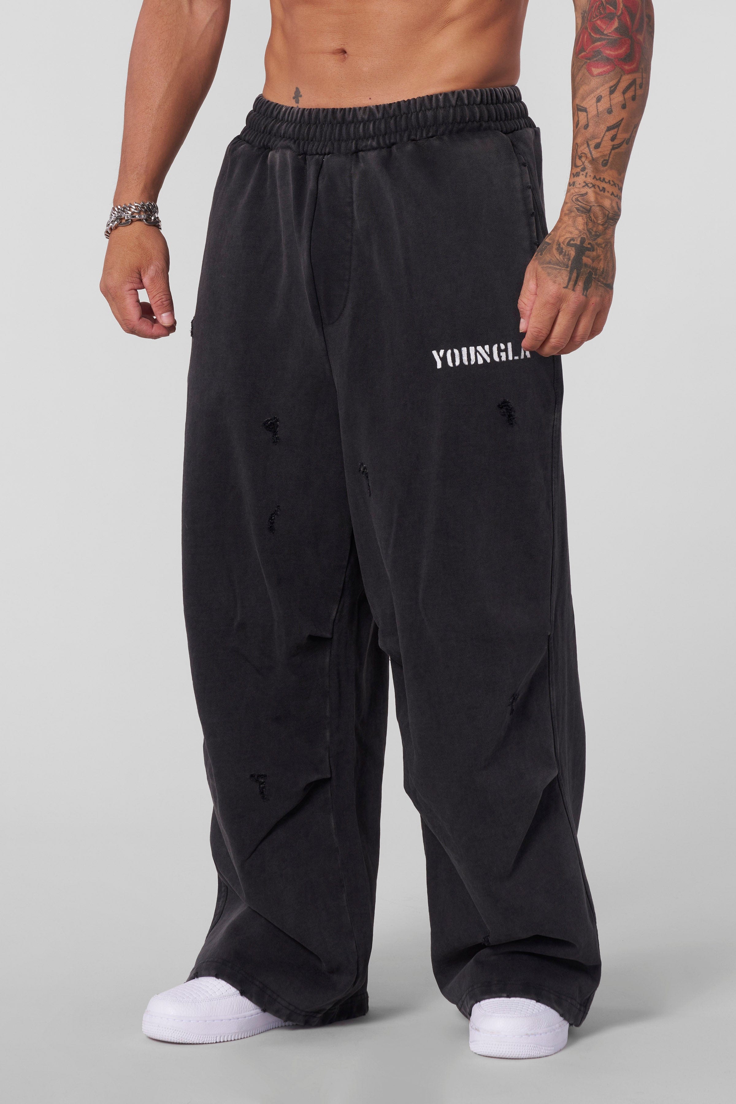 Front view of Urban Edge Baggy Cotton Sweatpants in a streetwear outfit.