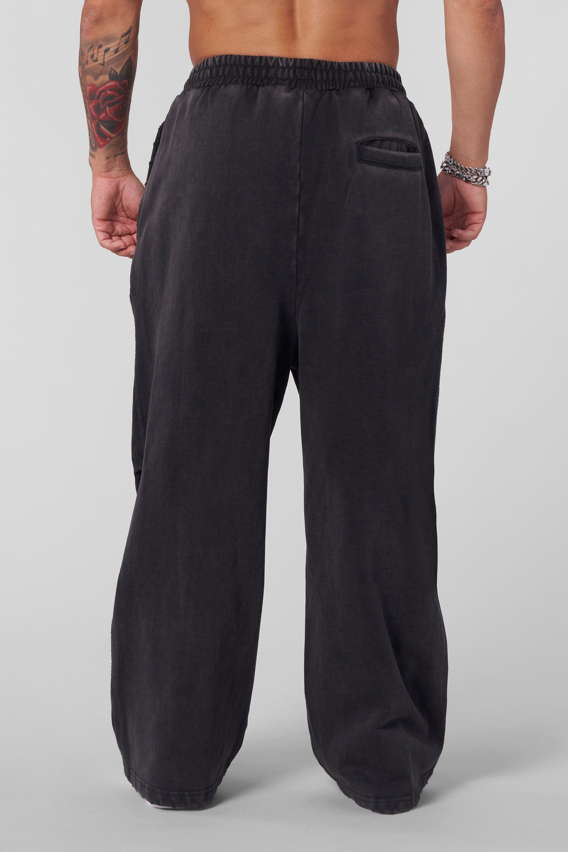 Side view showcasing the baggy fit of the cotton sweatpants.