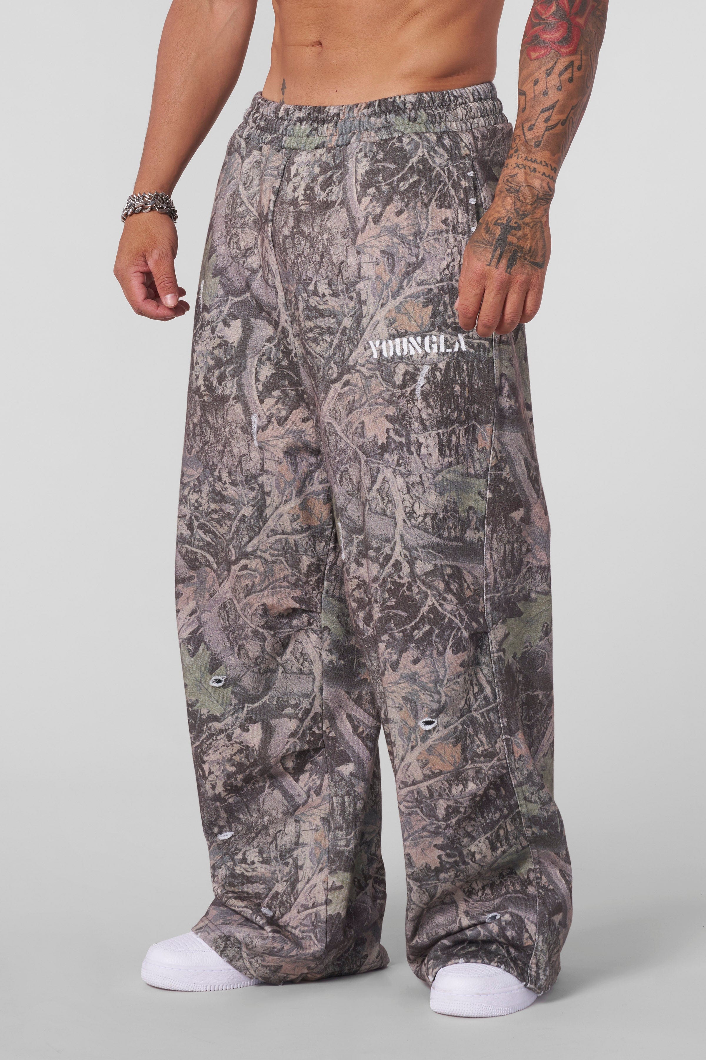 Side view showcasing the baggy fit of the cotton sweatpants.