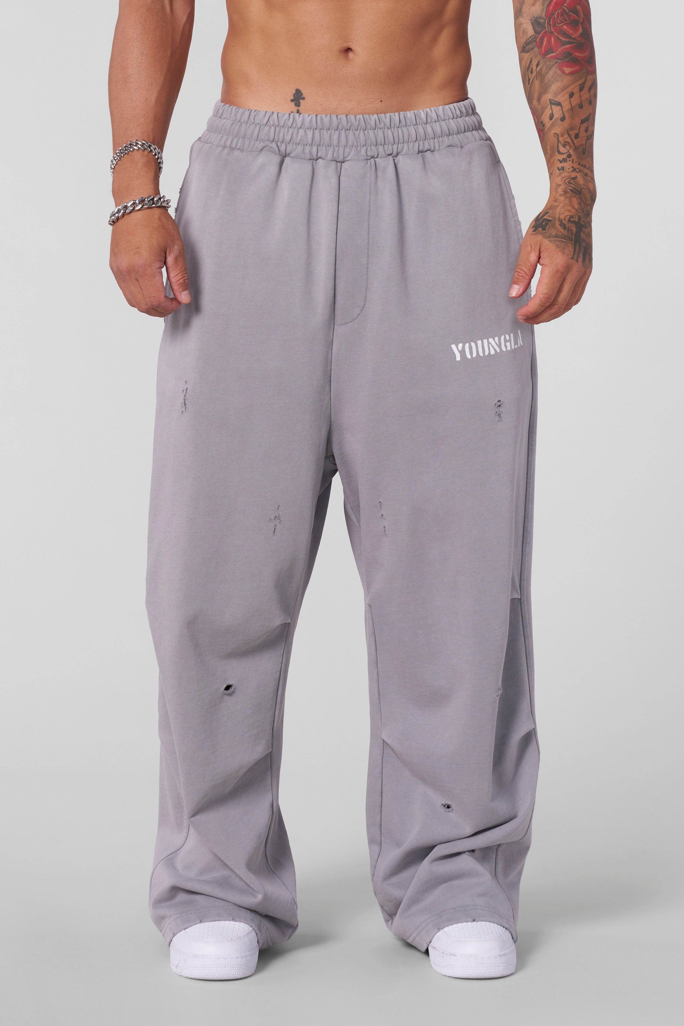 Close-up of the raw distress cuts on the Urban Edge sweatpants.