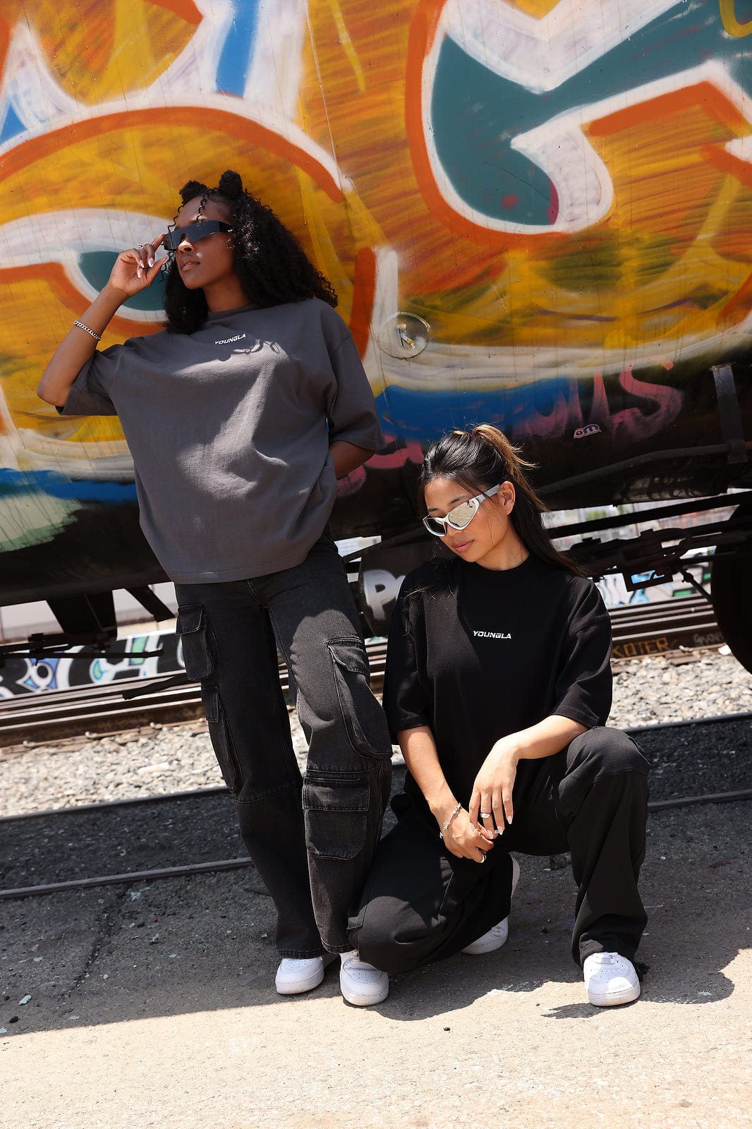 Front view of oversized digital graphic tee with bold print