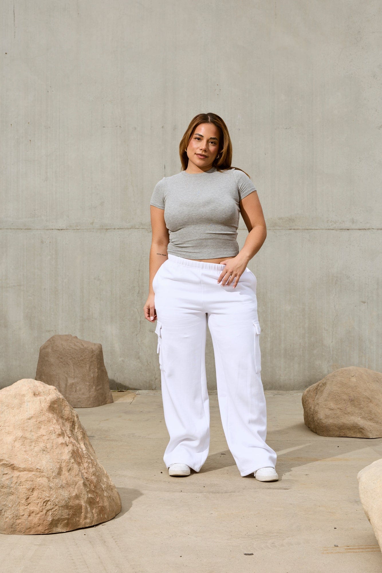 Model wearing the classic baby tee styled with casual jeans for a chic look.