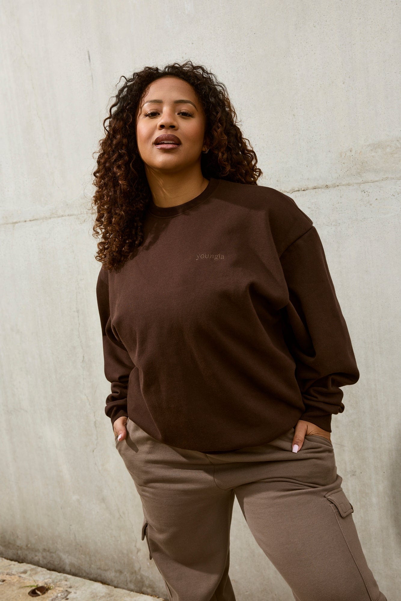 Front view of cotton crewneck sweatshirt styled casually on female model in New York