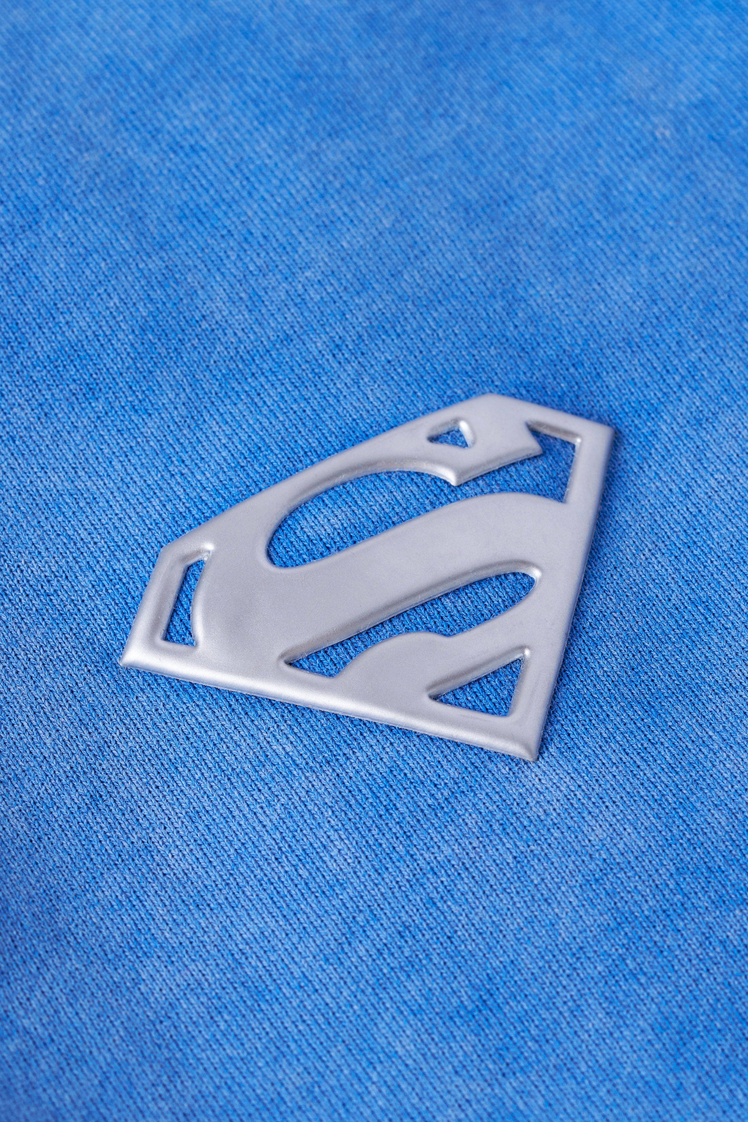 Close-up of YoungLA chrome logo on left leg