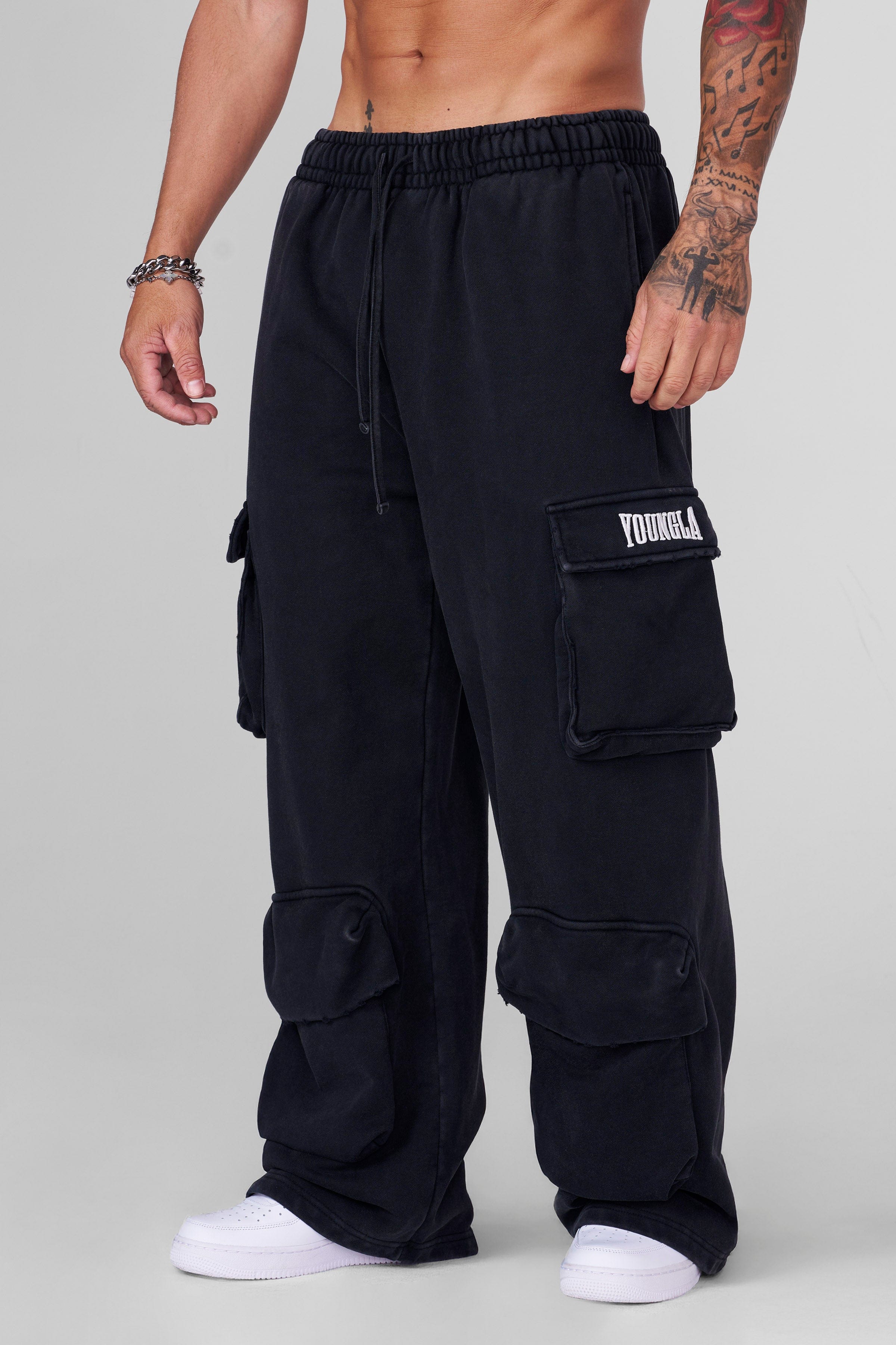 Front view of Heritage Cargo Sweatpants showcasing baggy fit and pockets.