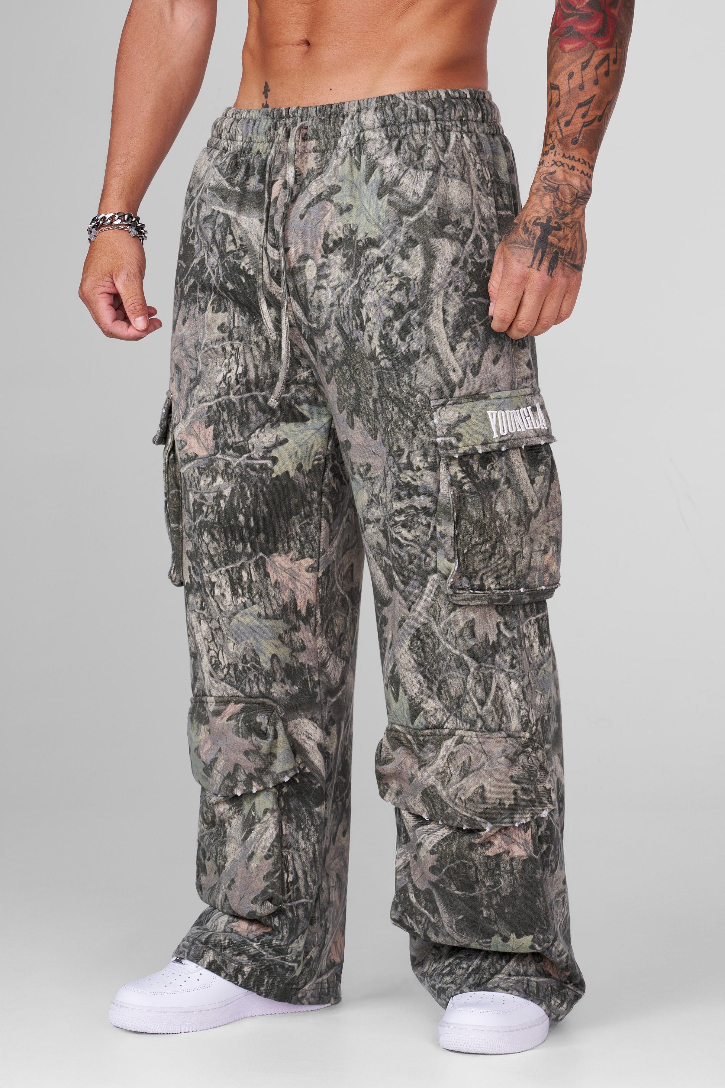 Side view of heavy cotton cargo sweatpants in camo design.