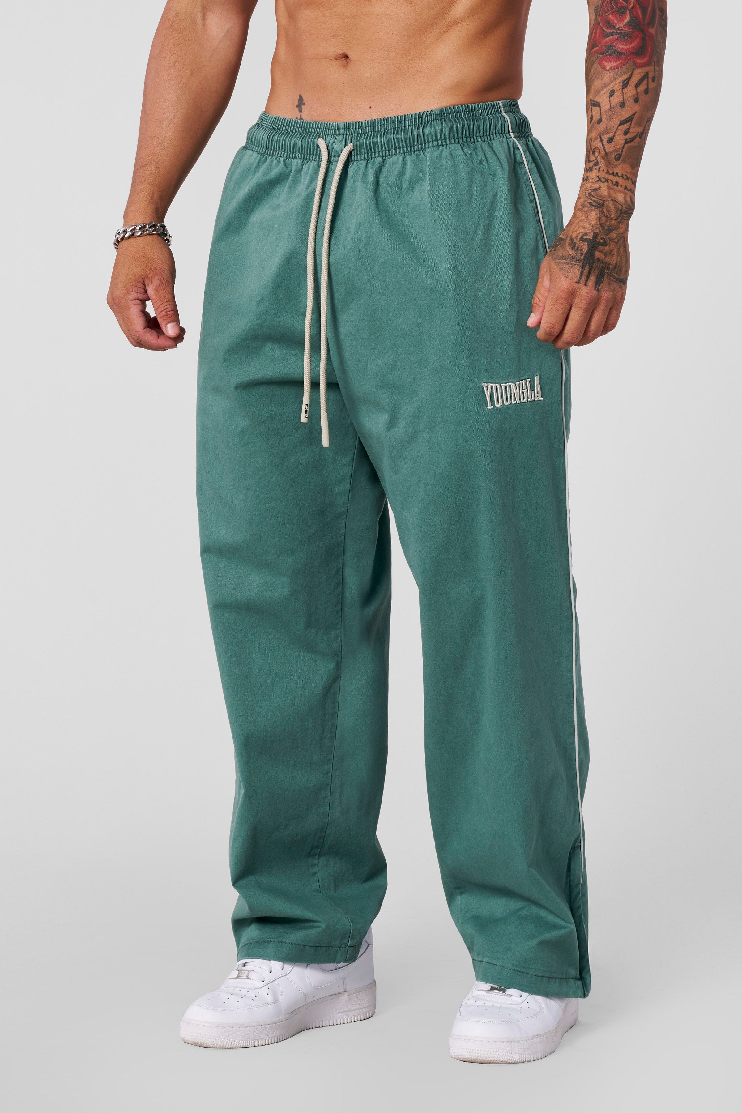 Side view of vintage charm loose fit pants in a relaxed setting.
