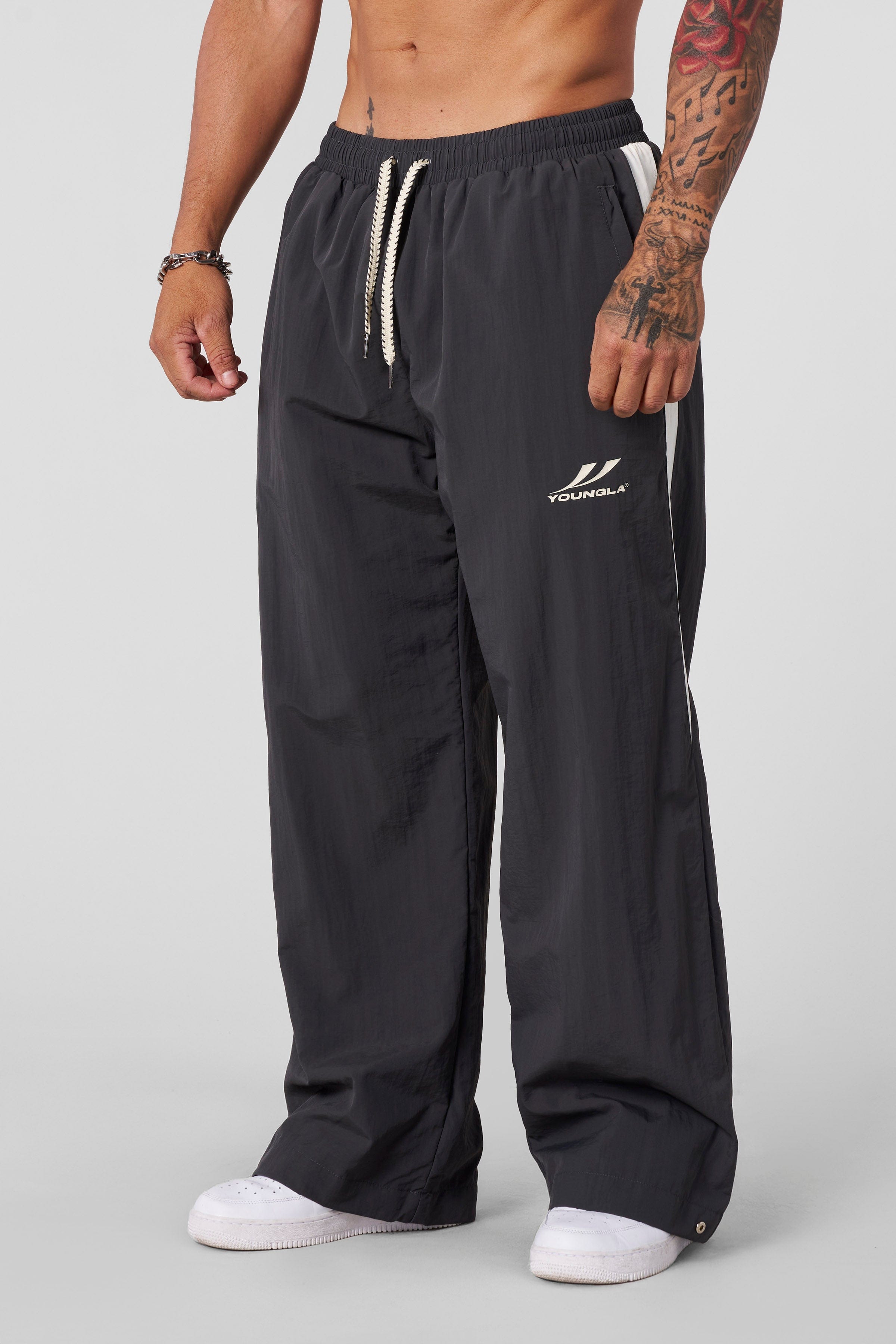Casual outdoor scene featuring baggy pants men in stylish winter wear.