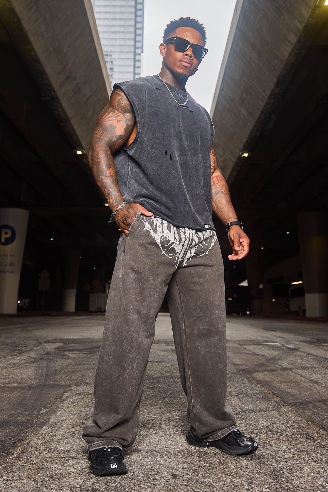 Outfit shot pairing joggers with Japanese streetwear hoodie