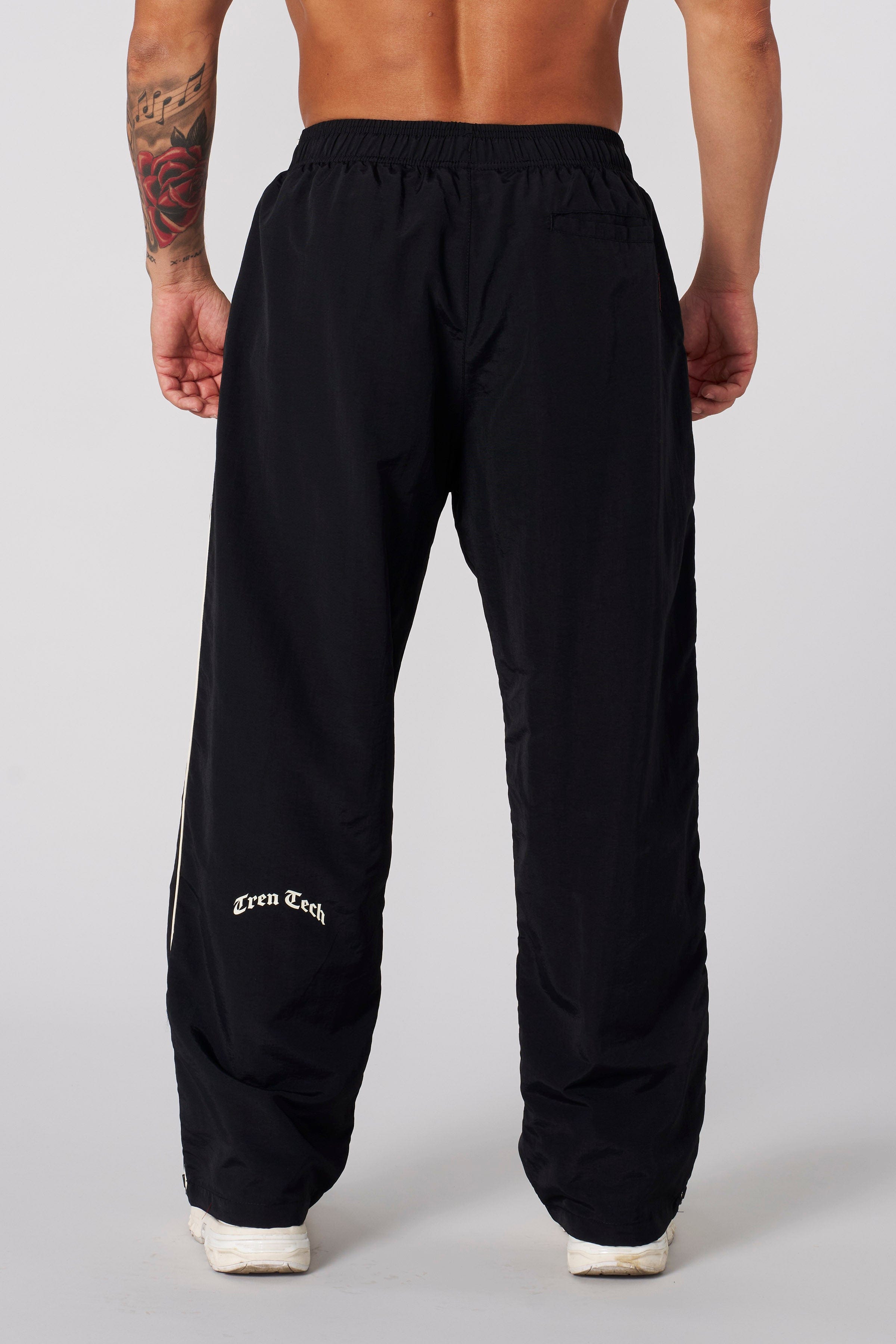 Close-up of Tren Twins camo sweatpants with contrasting side pipes.